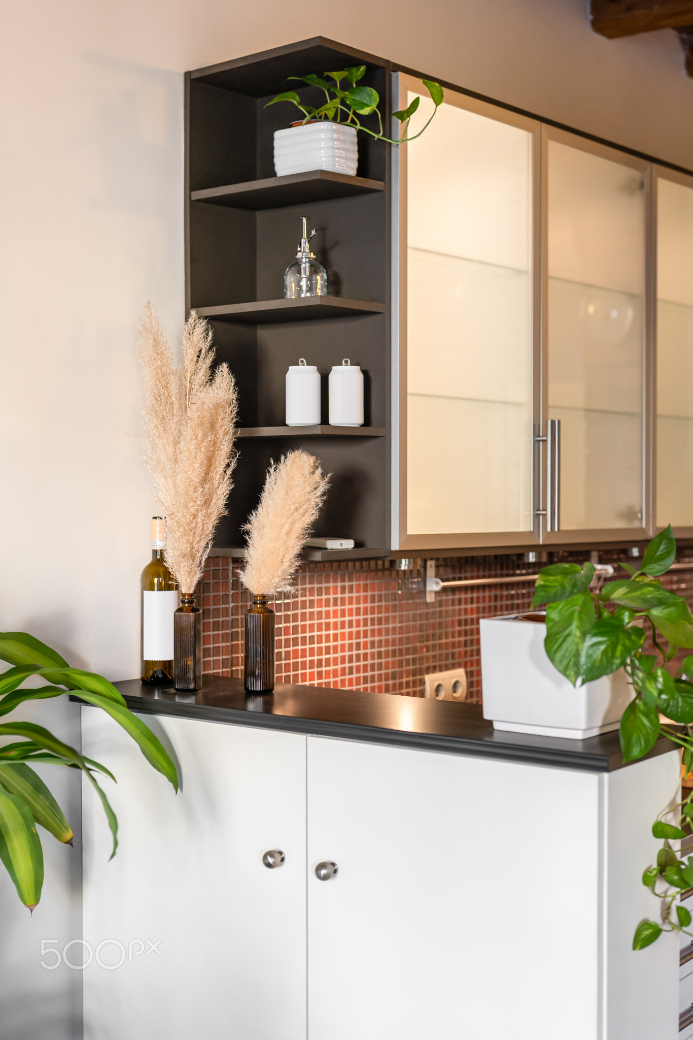 View of the mini bar with a built-in cabinet made of white painted