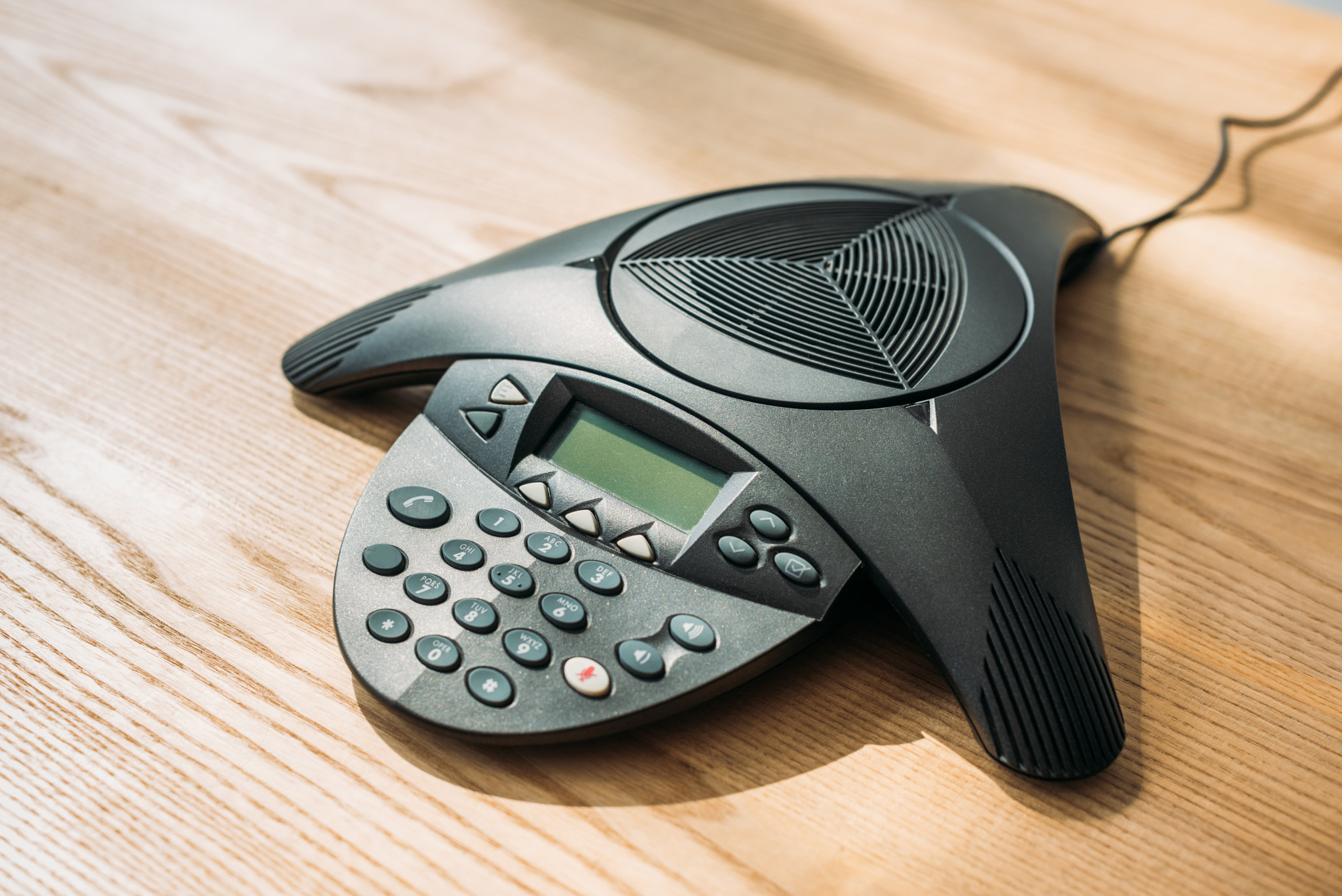 close shot conference phone wooden