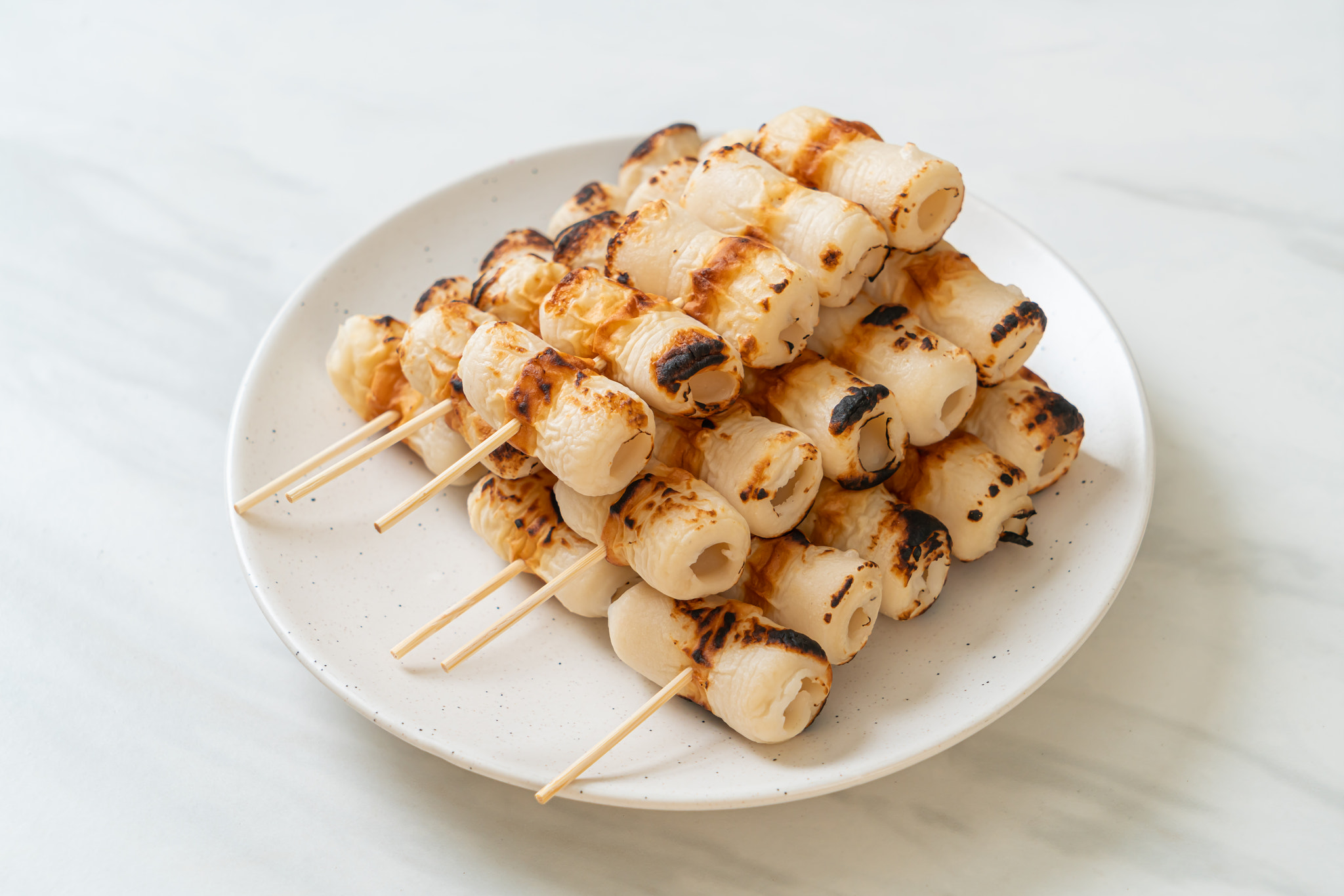 grilled tube shaped fish paste cake skewe or tube squid skewer