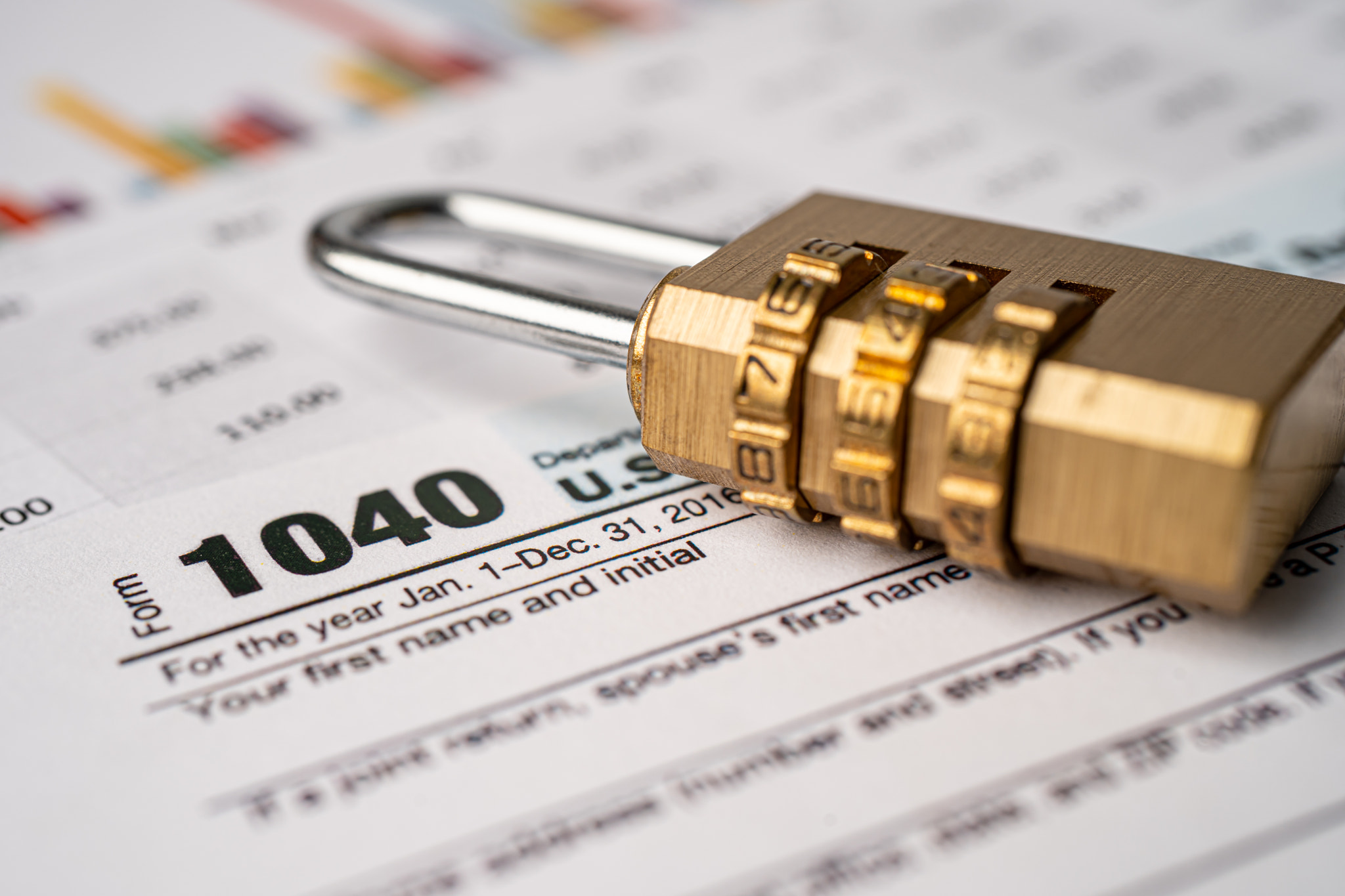 Tax Return form 1040 and Golden security digital password lock key, U.S. Individual Income.