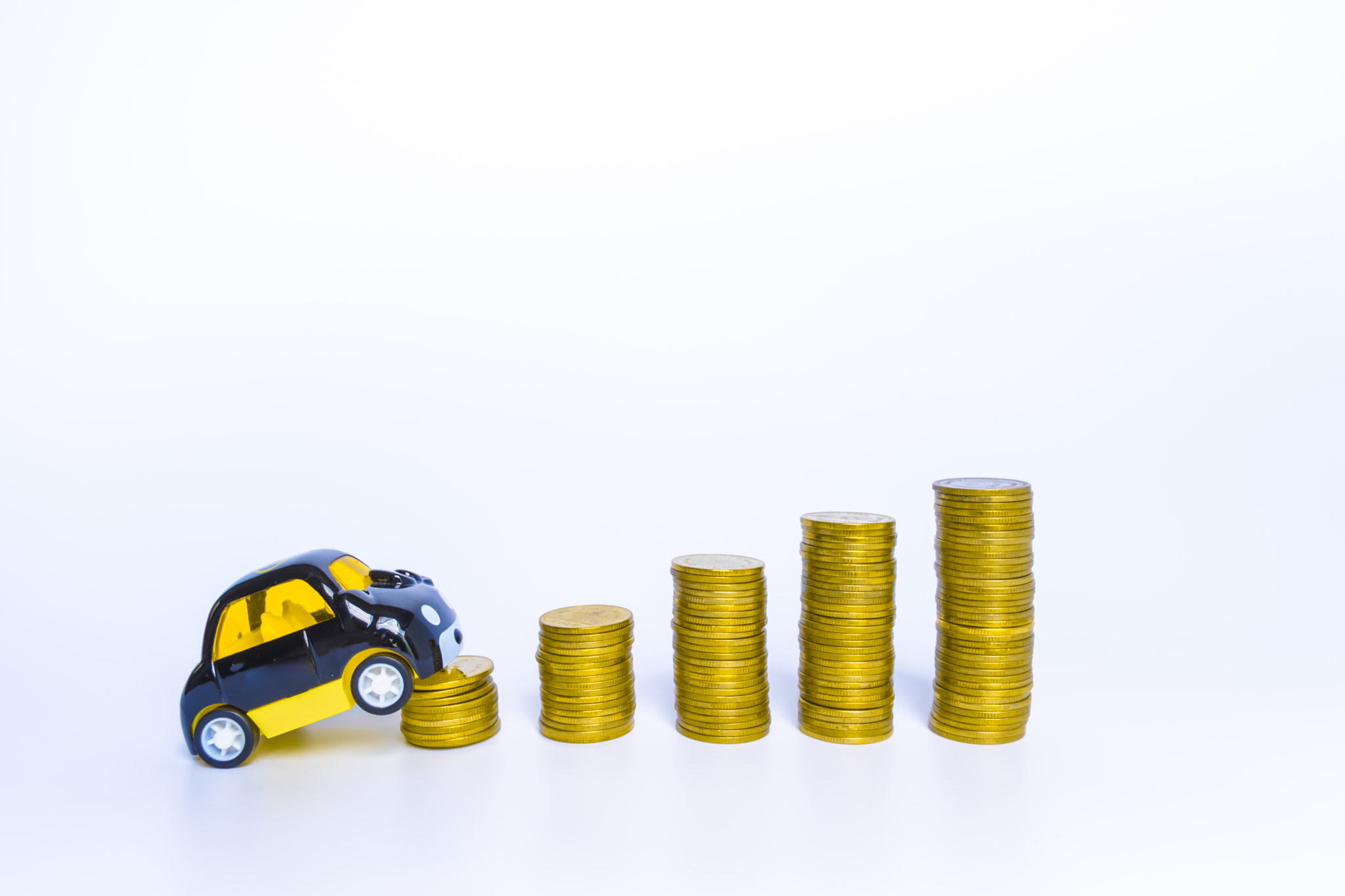 Saving money concept and money coin stack on car, bank loans costs finance. insurance, buying car fi