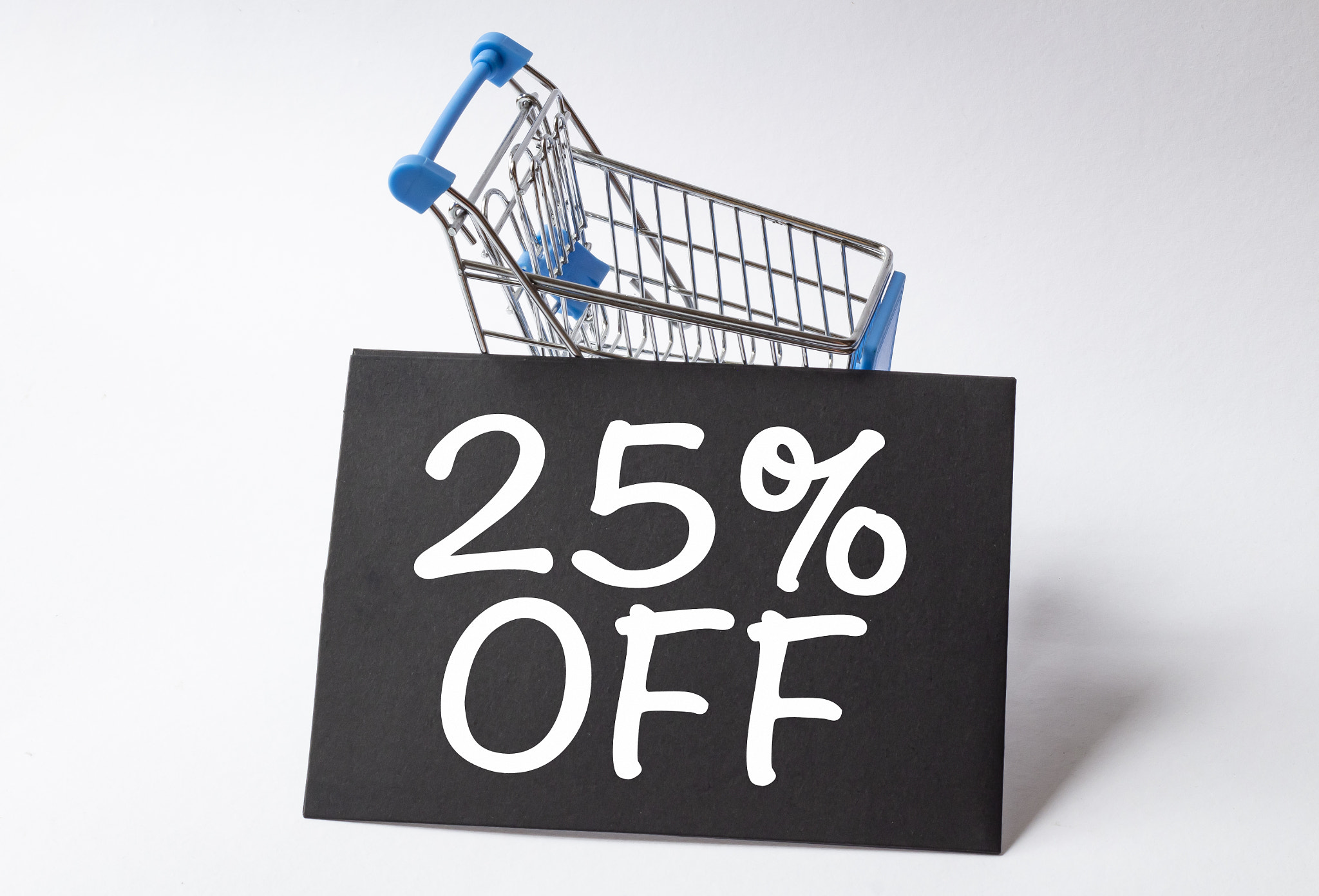 25 percent off words on black paper and shopping card