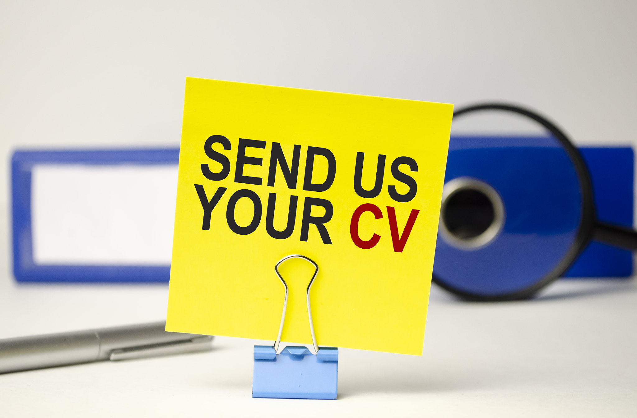 yellow, sticker paper folder, pen and send us your cv words