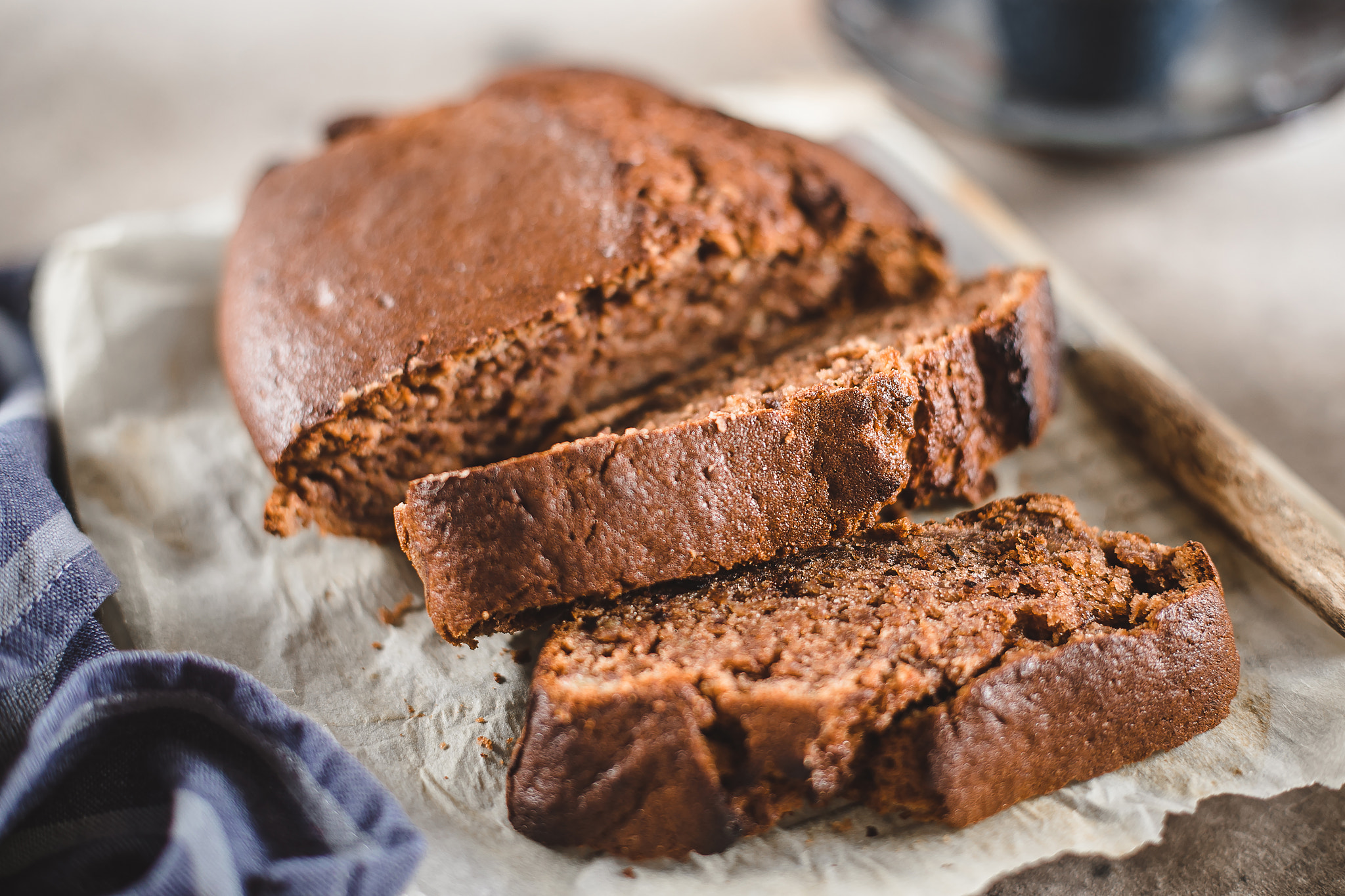 Banana bread sliced with coffee. Vegan pasrty. Home bakery concept. Close-up