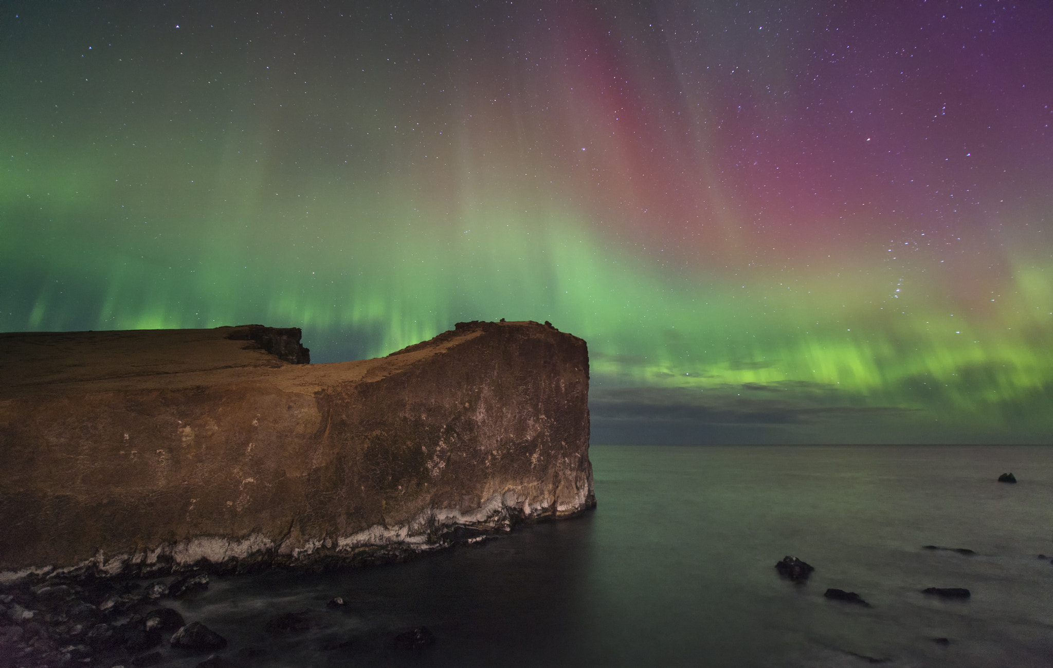 lonely cliff in aurora light