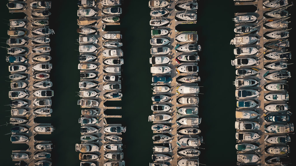 Aerial view of boats moored at harbor by Hayden Kent on 500px.com