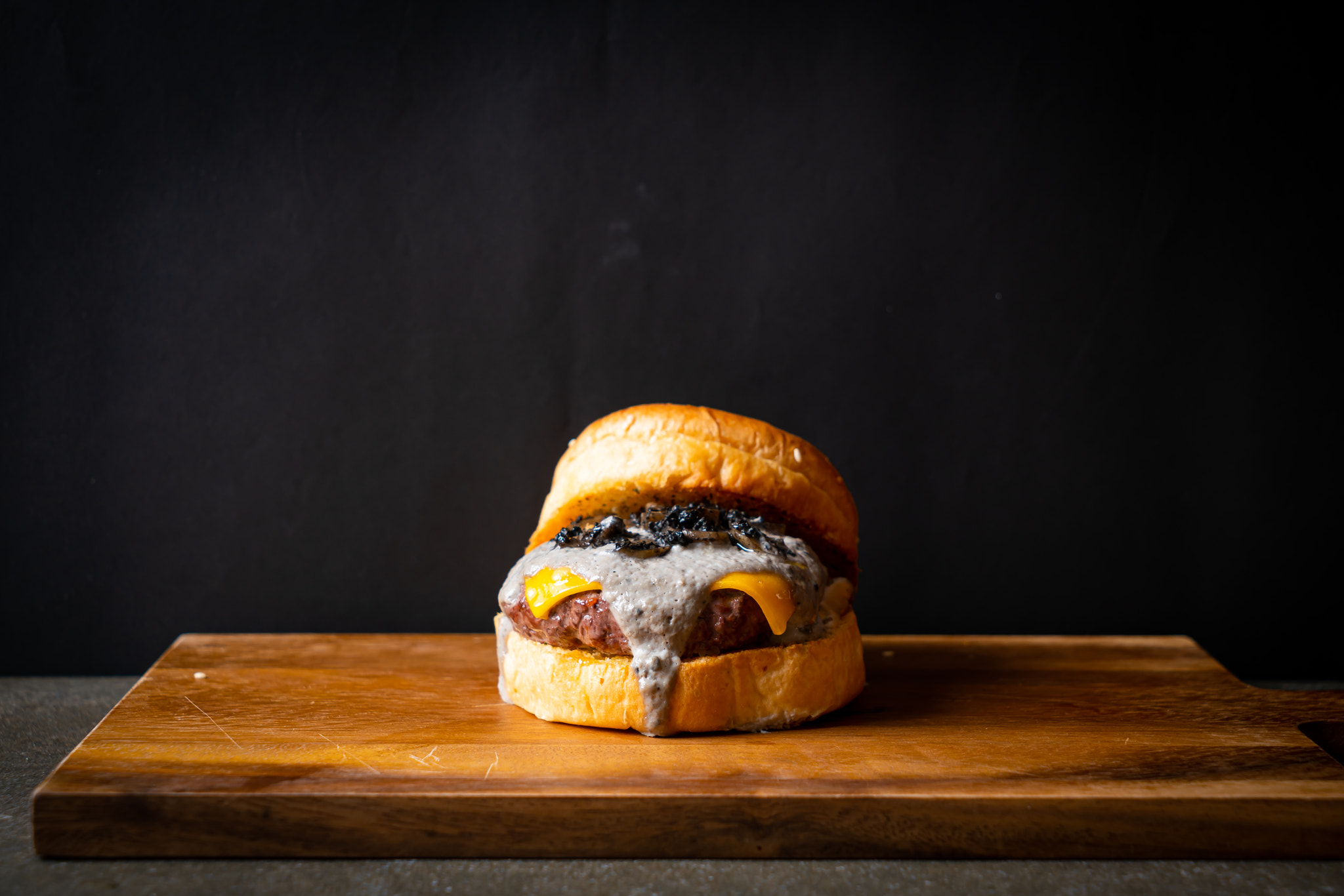 truffle burger - beef with cheese and truffle mushroom sauce burger