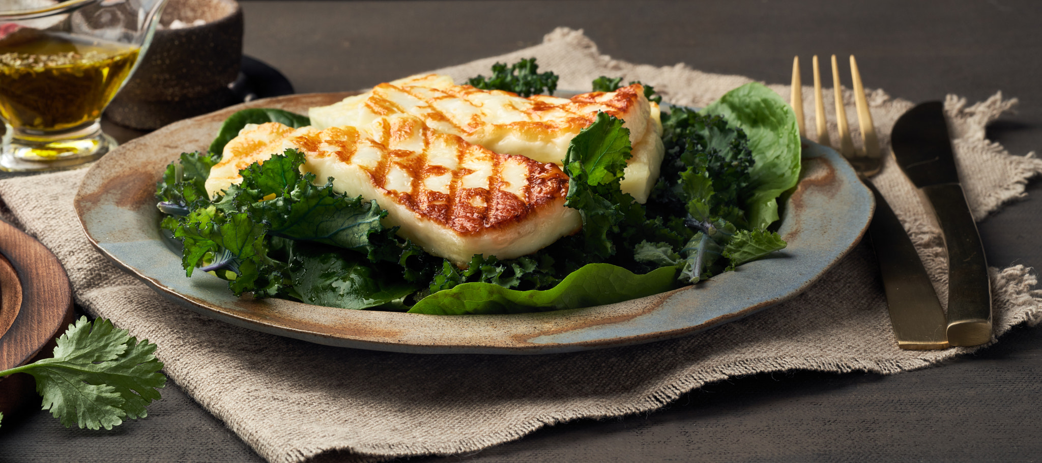 Cyprus fried halloumi cheese with healthy green salad. Lchf, pegan, fodmap, paleo, scd, keto diet.