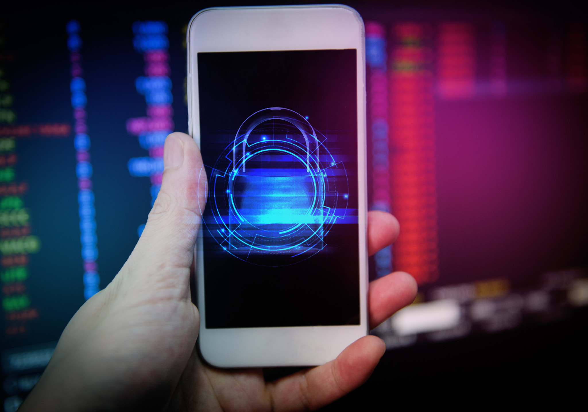 Data security systems on mobile phone with locked padlock for protect crime by an anonymous hacker -