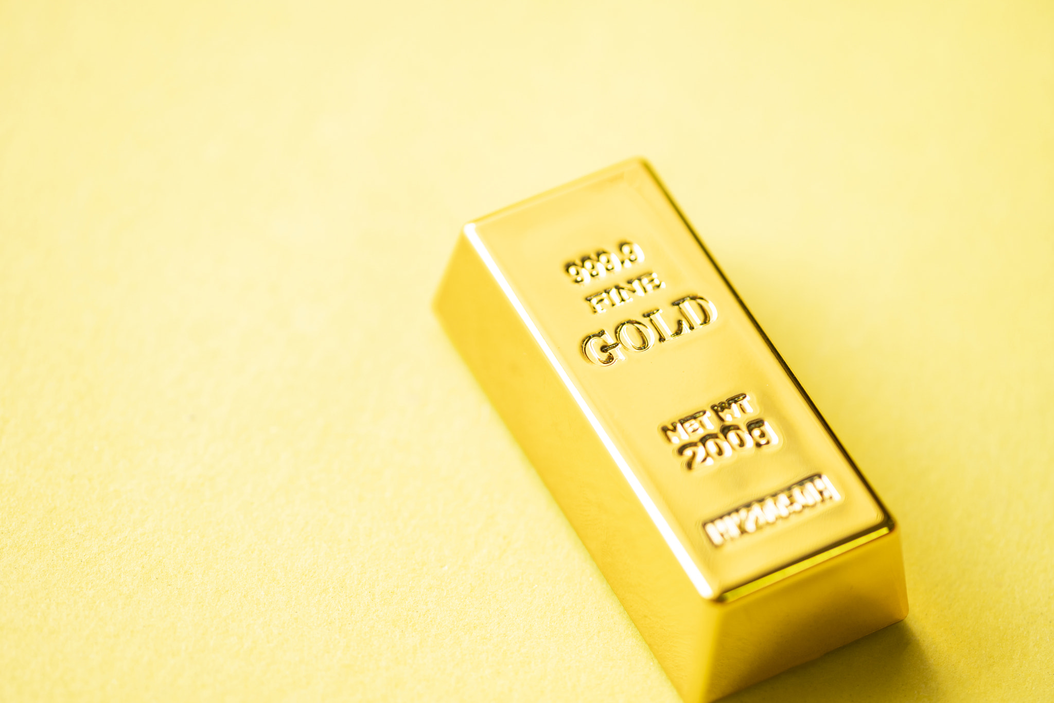 Gold bars on yellow background, gold bars financial business economy concepts, wealth and reserve su