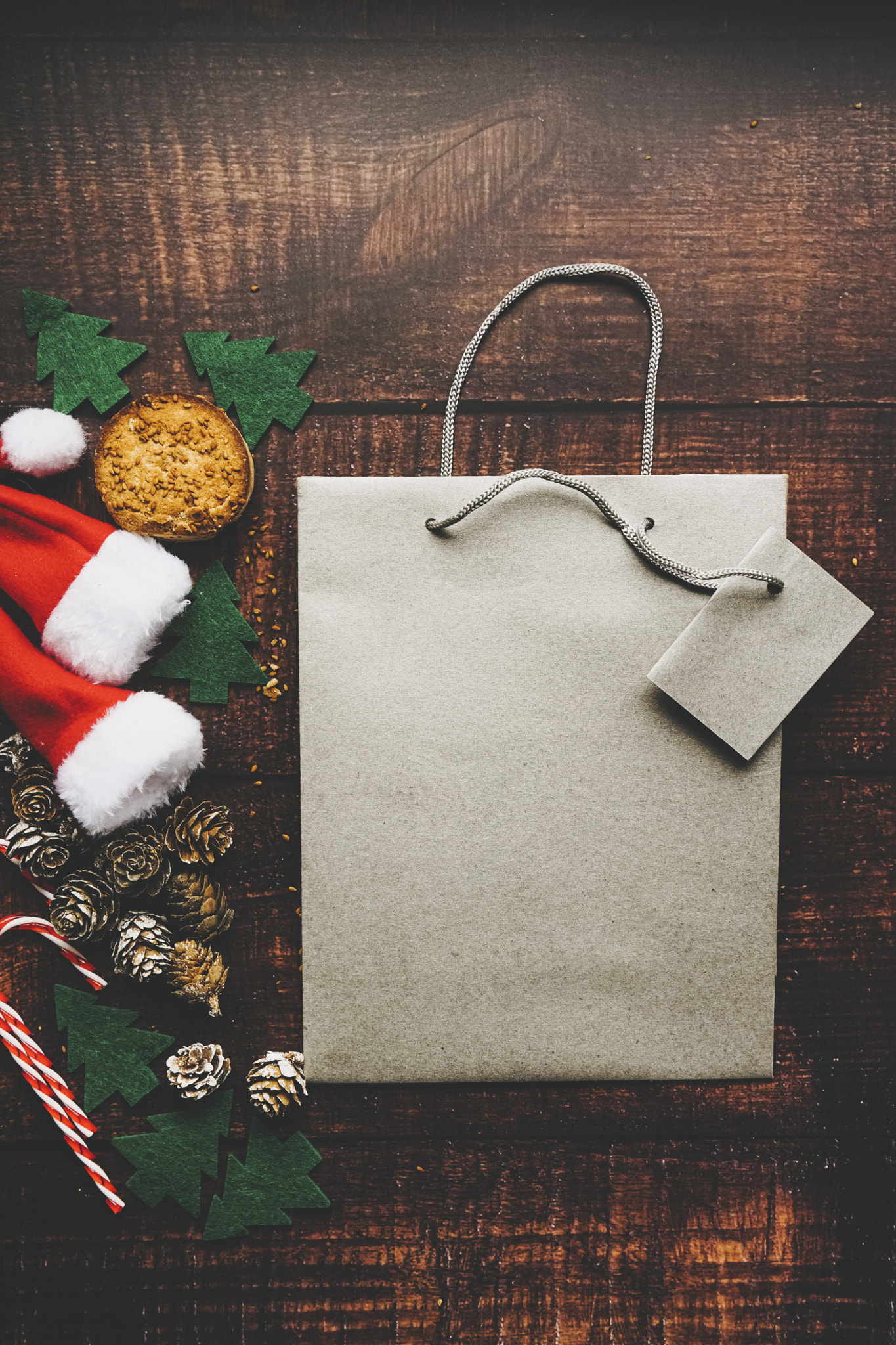 Christmas mockup with a gift bag surroundid by classical christmas decoration