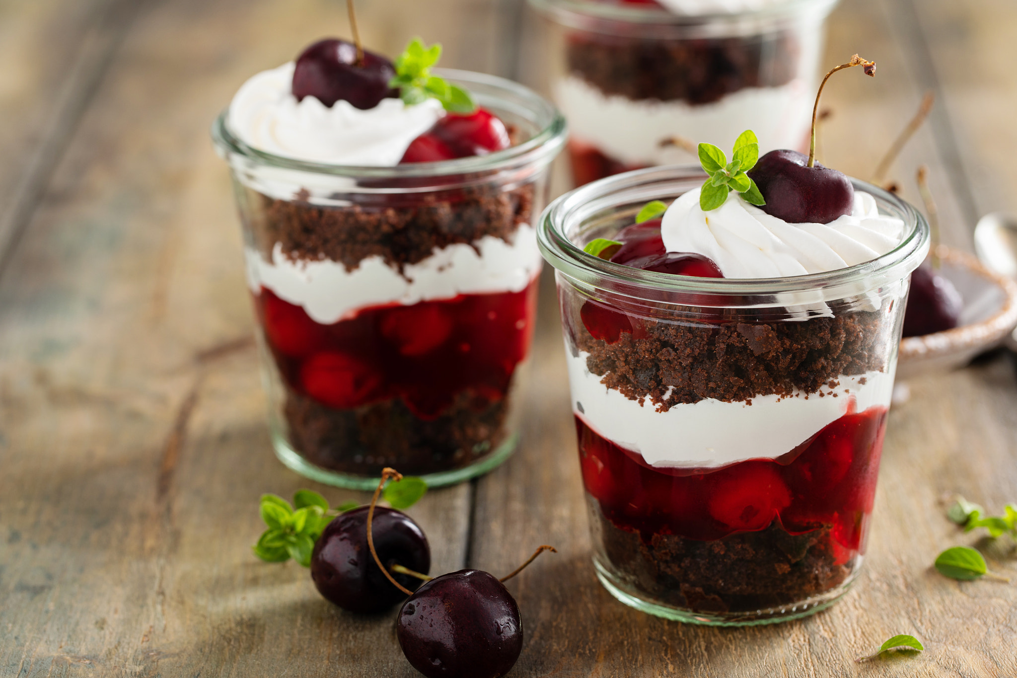 Black forest trifles, dessert in jars concept