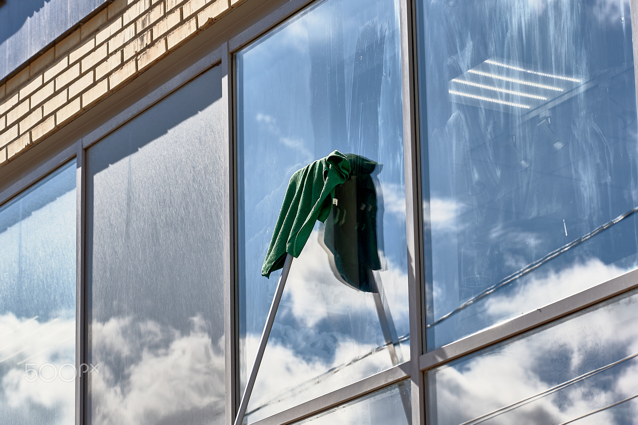 window washing, washing a street shop window
