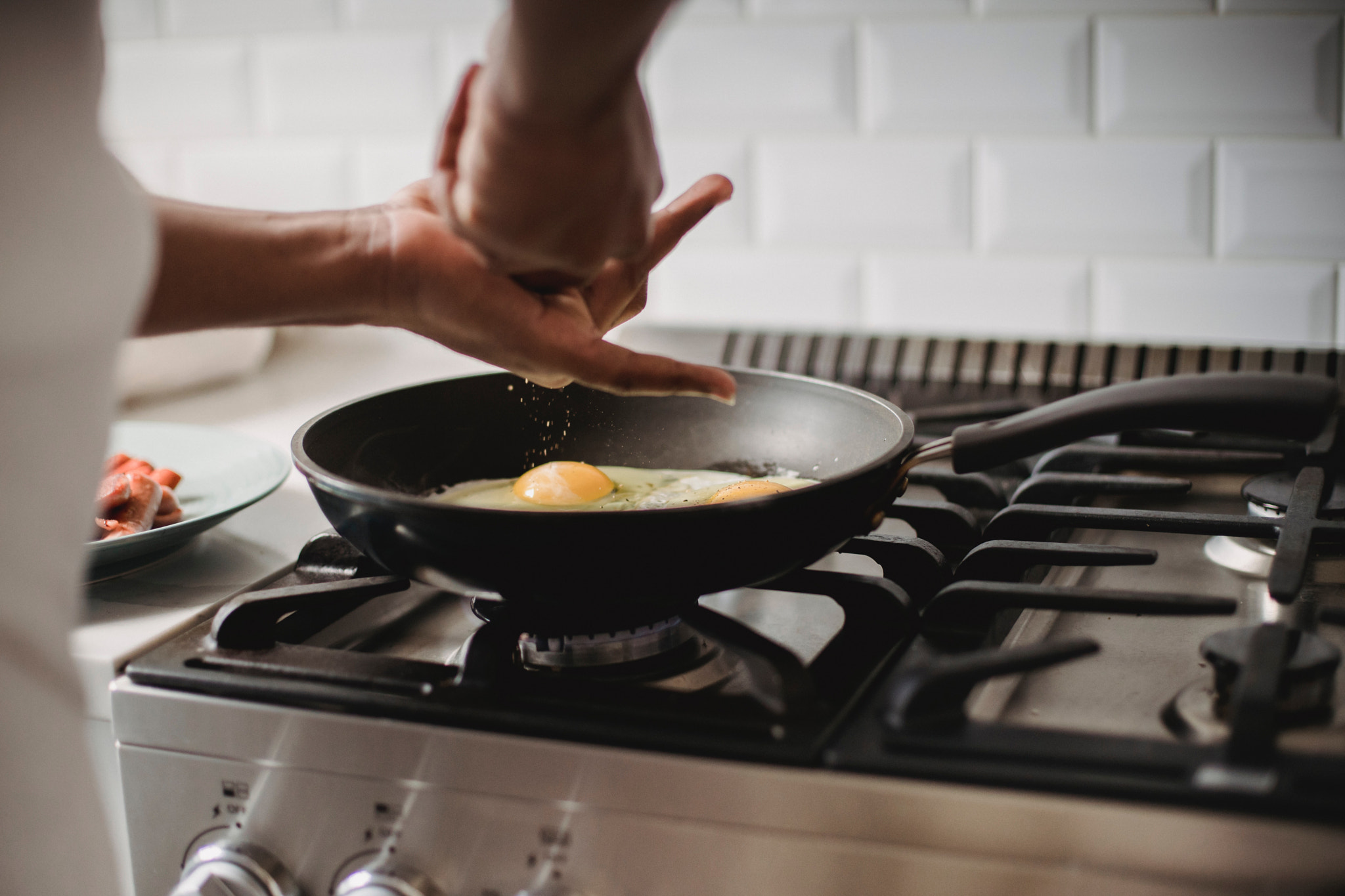 Midsection of woman preparing food in kitchen