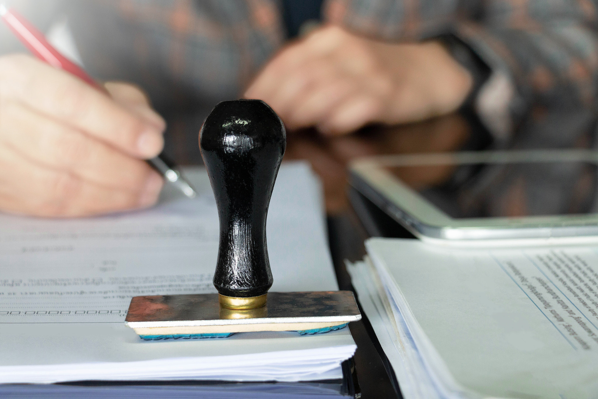 rubber stamper on white paperwork