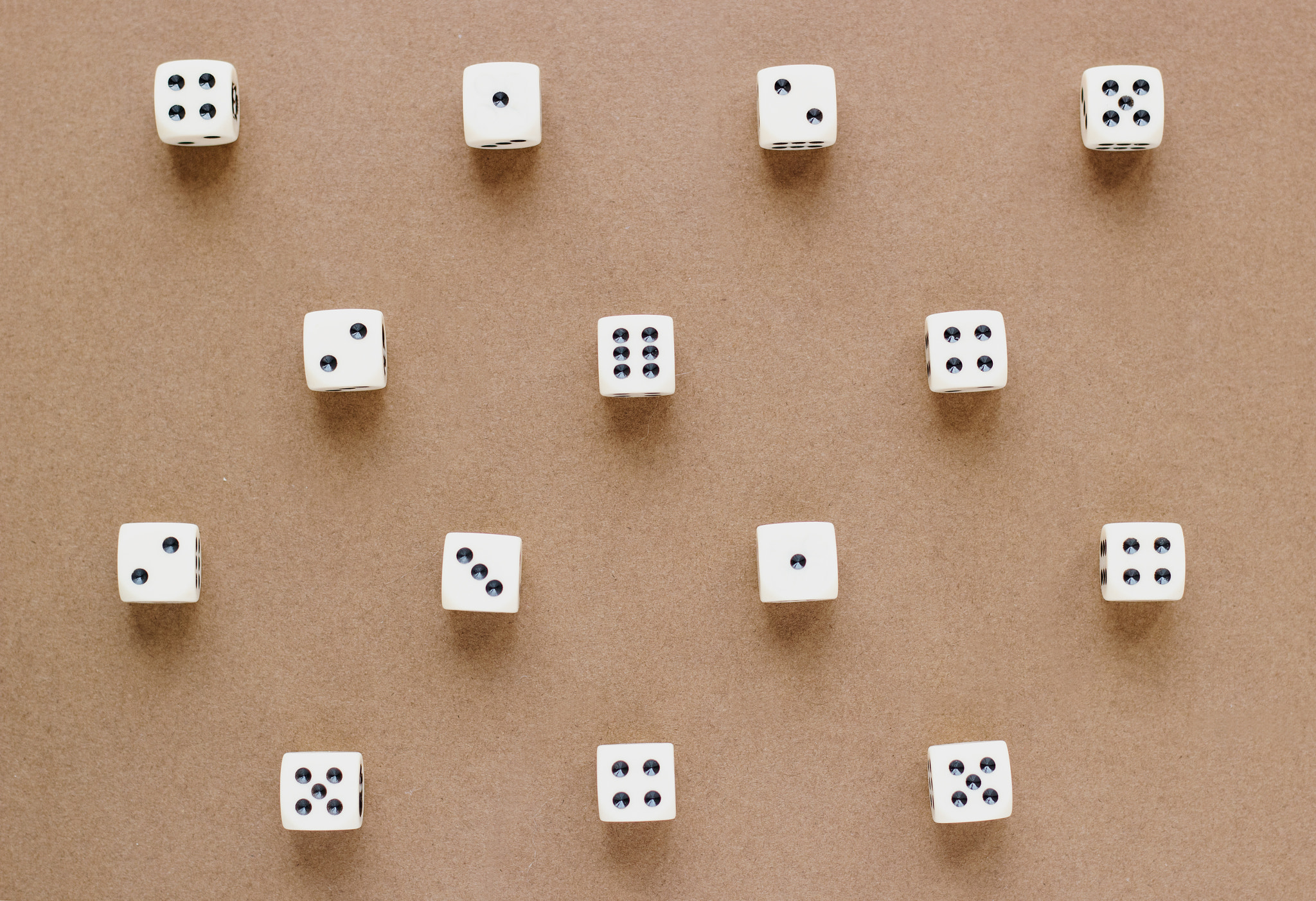 Close-up of dices on beige background