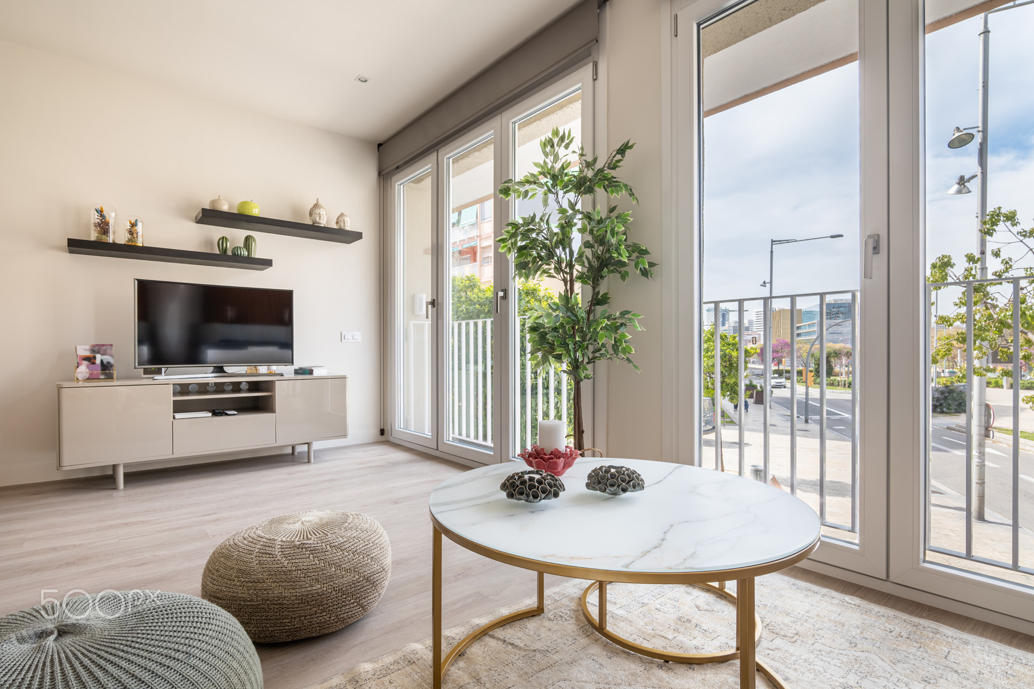 Comfortable living room with large windows and natural light with