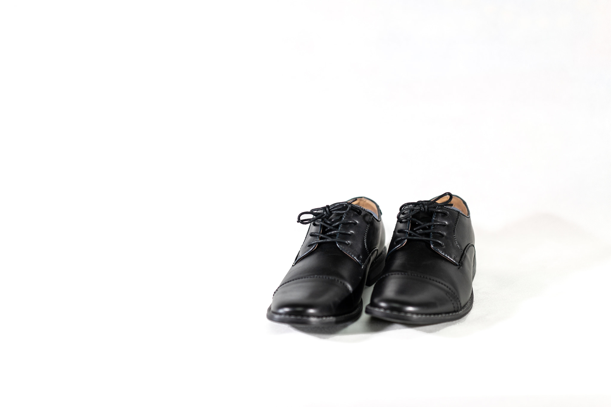 Luxuary man leather black shoe on the white isolation backtground.