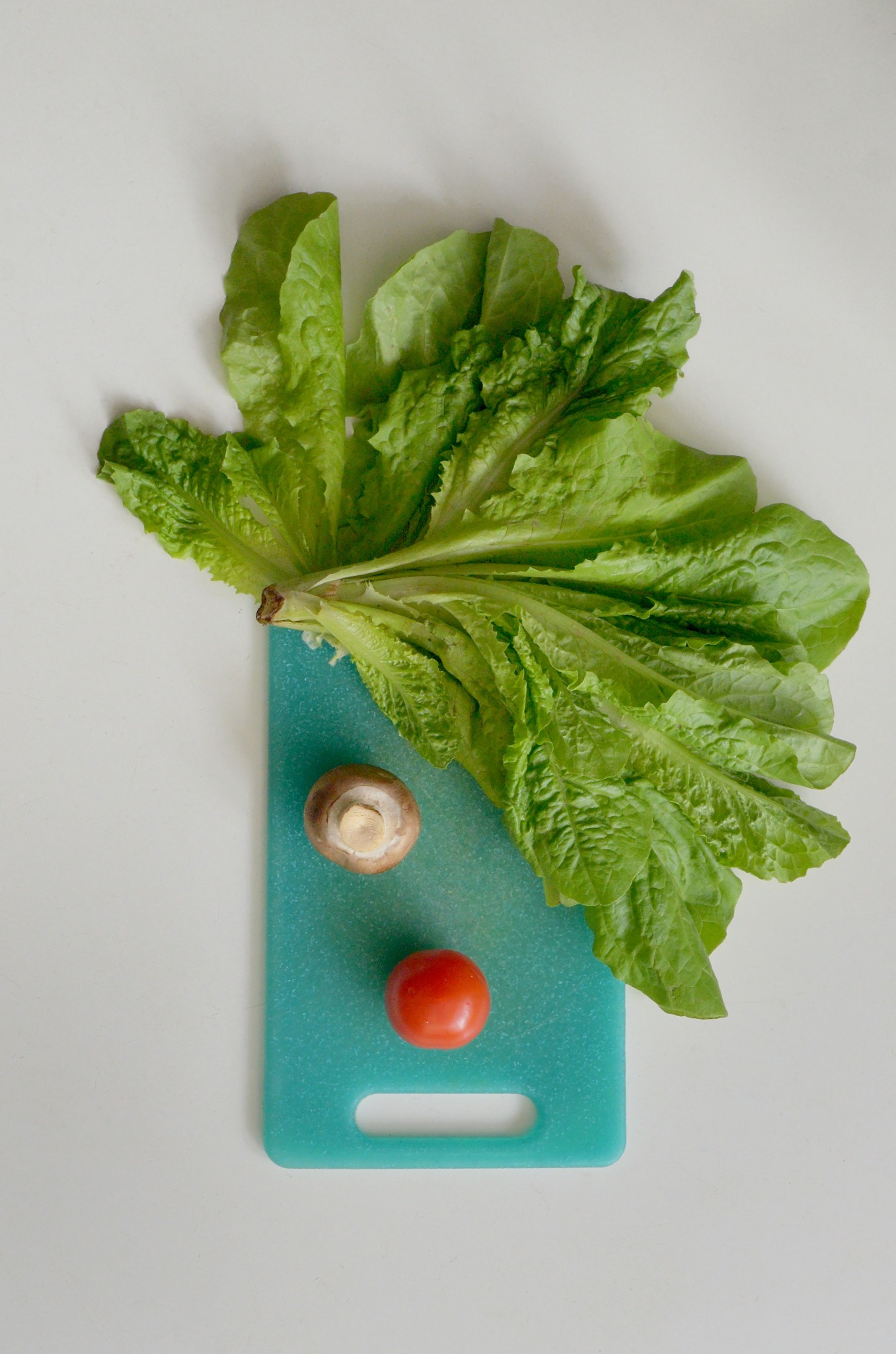 Clown's Face From Vegetables on Cutting Board