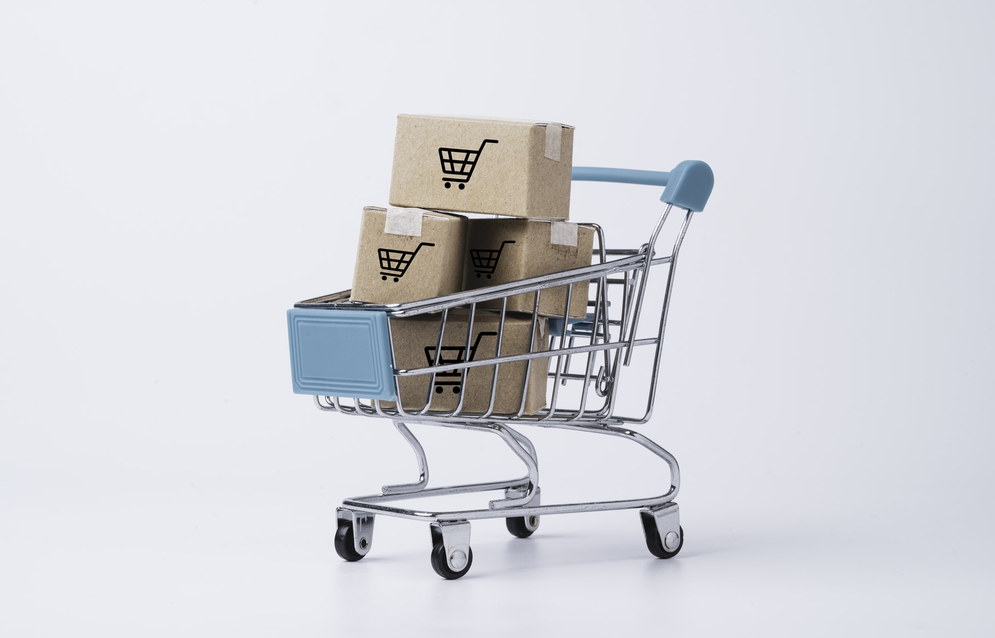 Isolated of Shipping paper carton boxes inside of shopping trolley cart on white background for onli