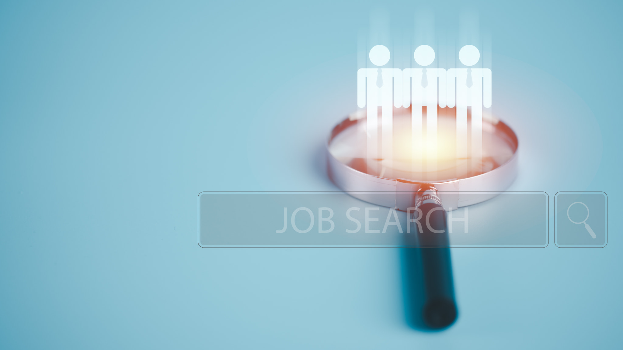 Magnifying glass on the table, job search and employment concept through online networking technolog