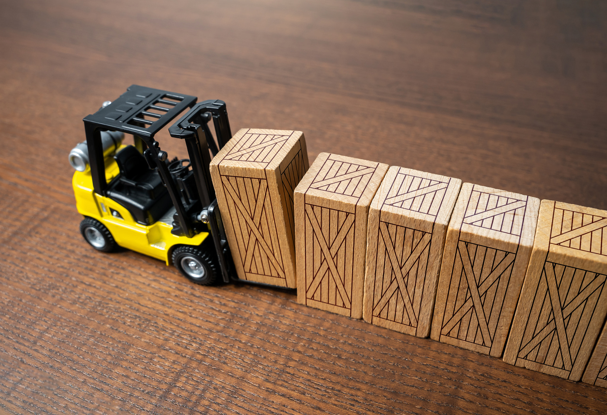 A forklift transports wooden crates. Transportation industry. Transport department. Warehousing, log