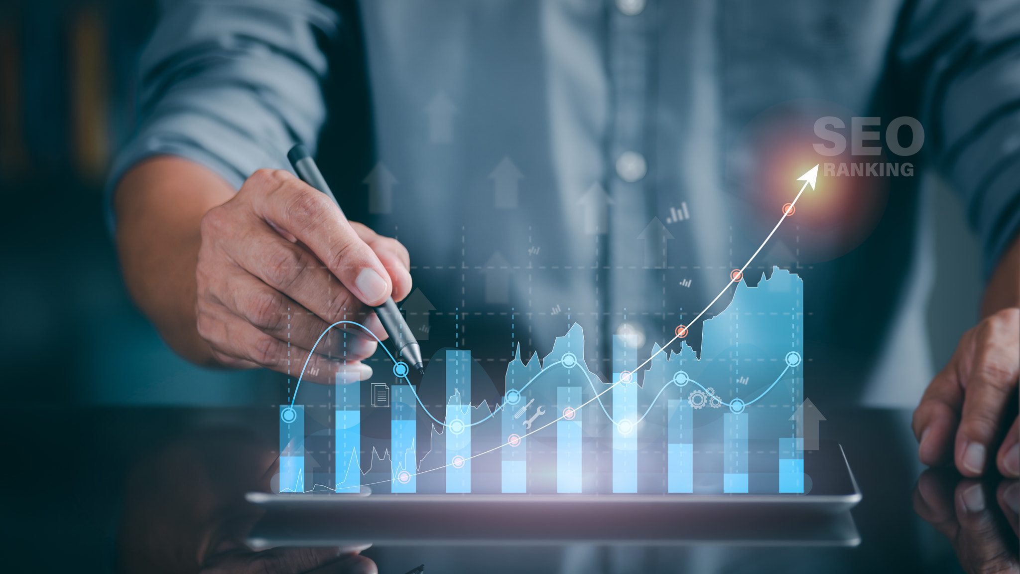 A marketer holds a pen pointing to a graph and shows SEO concepts, optimization analysis tools, sear