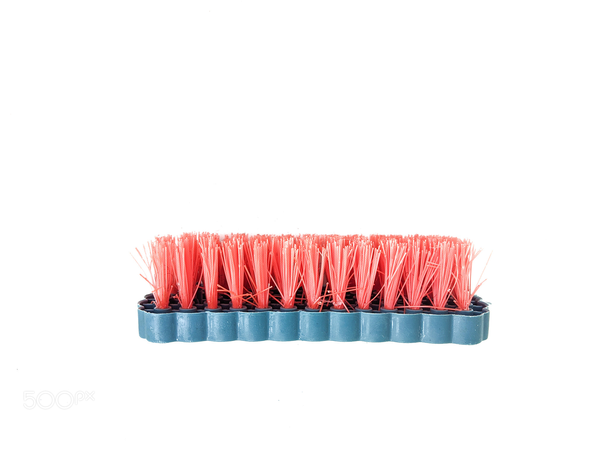 Plastic brush with orange bristles for cleaning clothes, washing brush