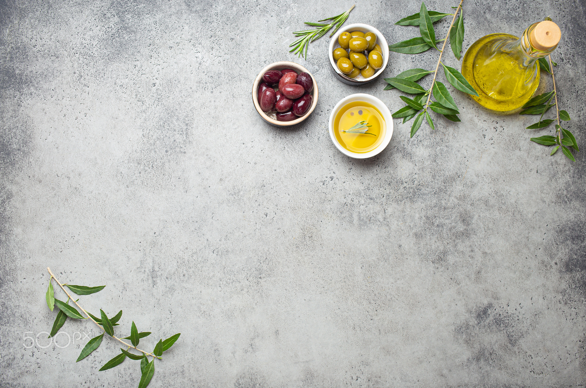 Composition with green and brown olives, extra virgin olive oil in