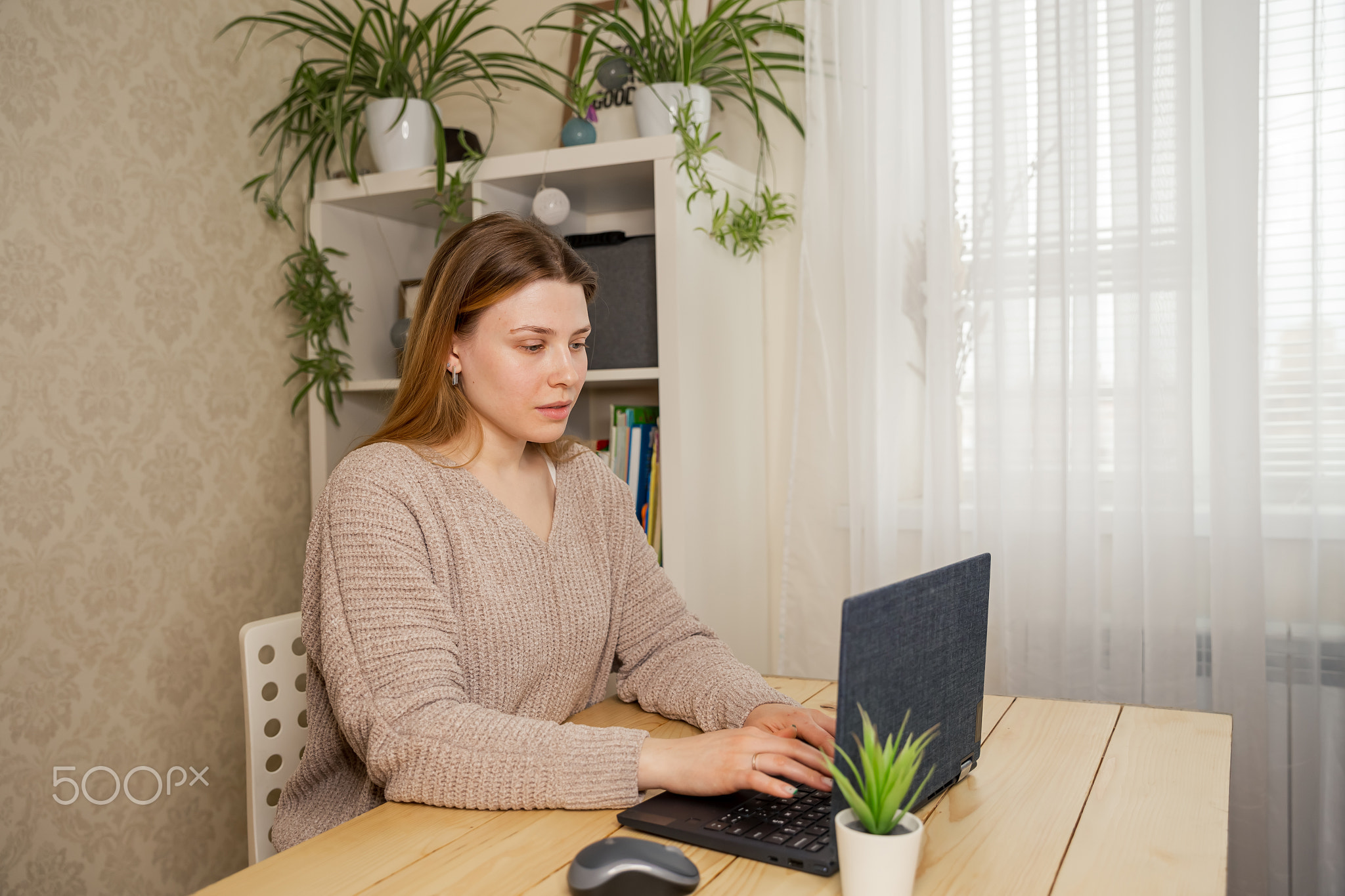 Student with laptop learning at home. Stay at home entertainment.