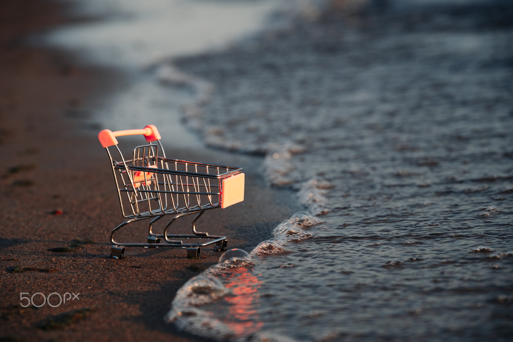 Empty Shopping Basket On Beach, Which Is Covered By Wave. Summer Sale
