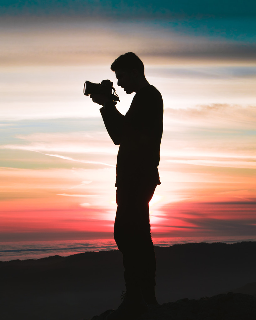 silhouette photo of holding camera by EBENEZER Eben on 500px.com