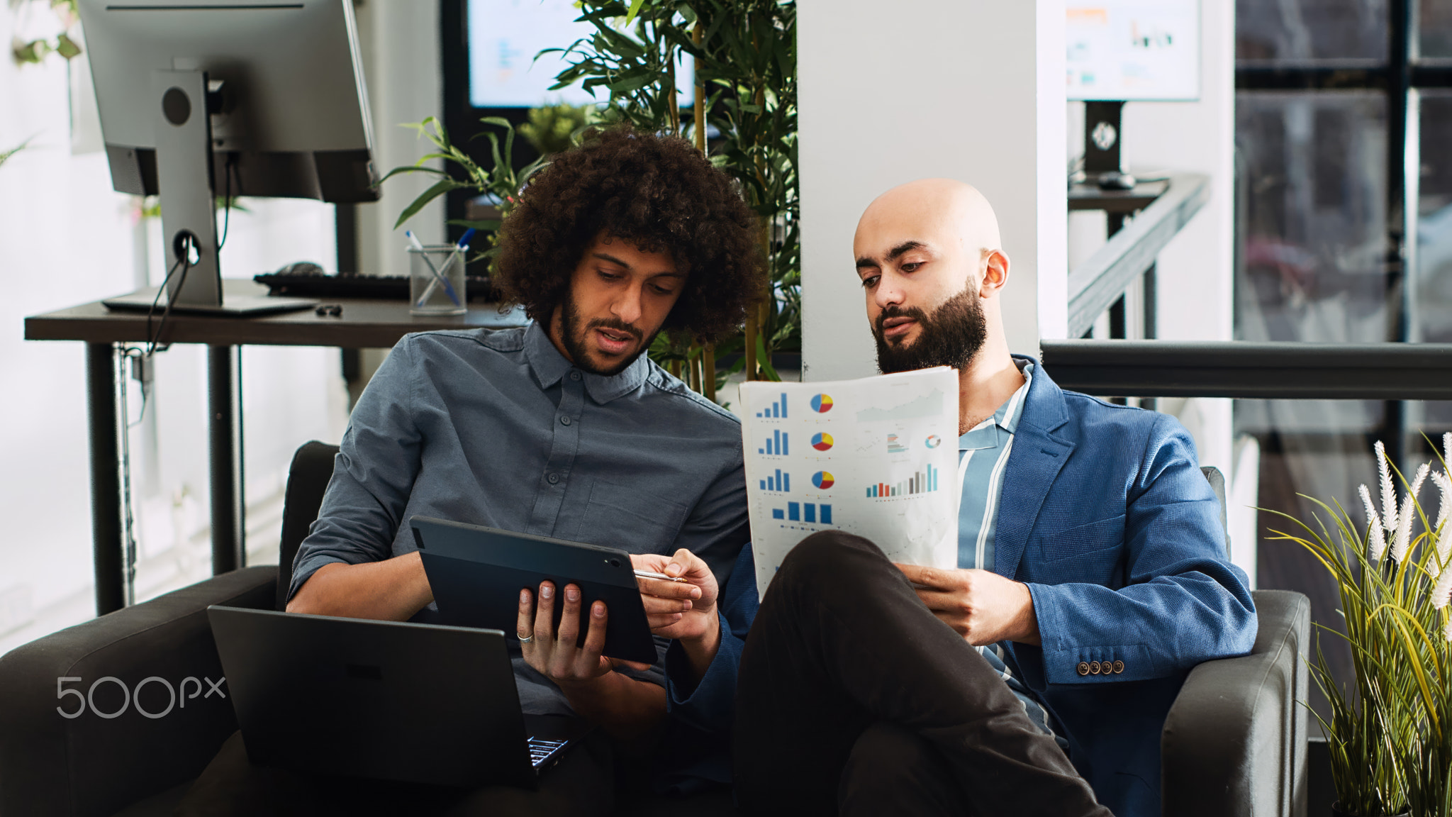 Colleagues review annual statistics