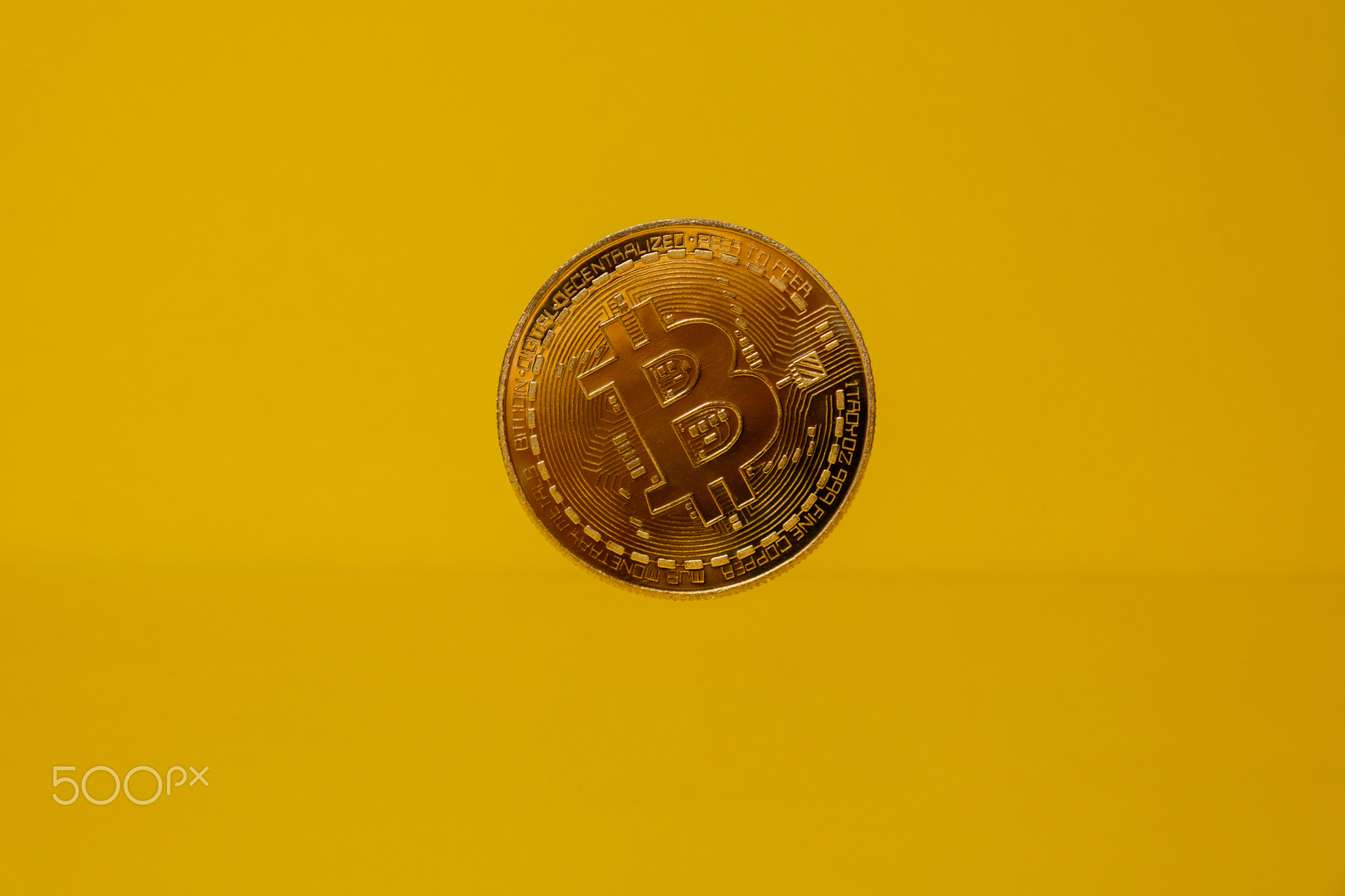 Bitcoin gold coin levitation with shadow reflection. Bitcoin flying