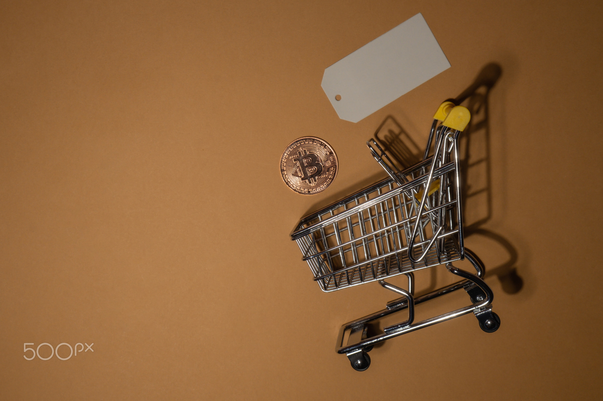Bitcoin gold coin with shopping trolley cart Buying or selling mining