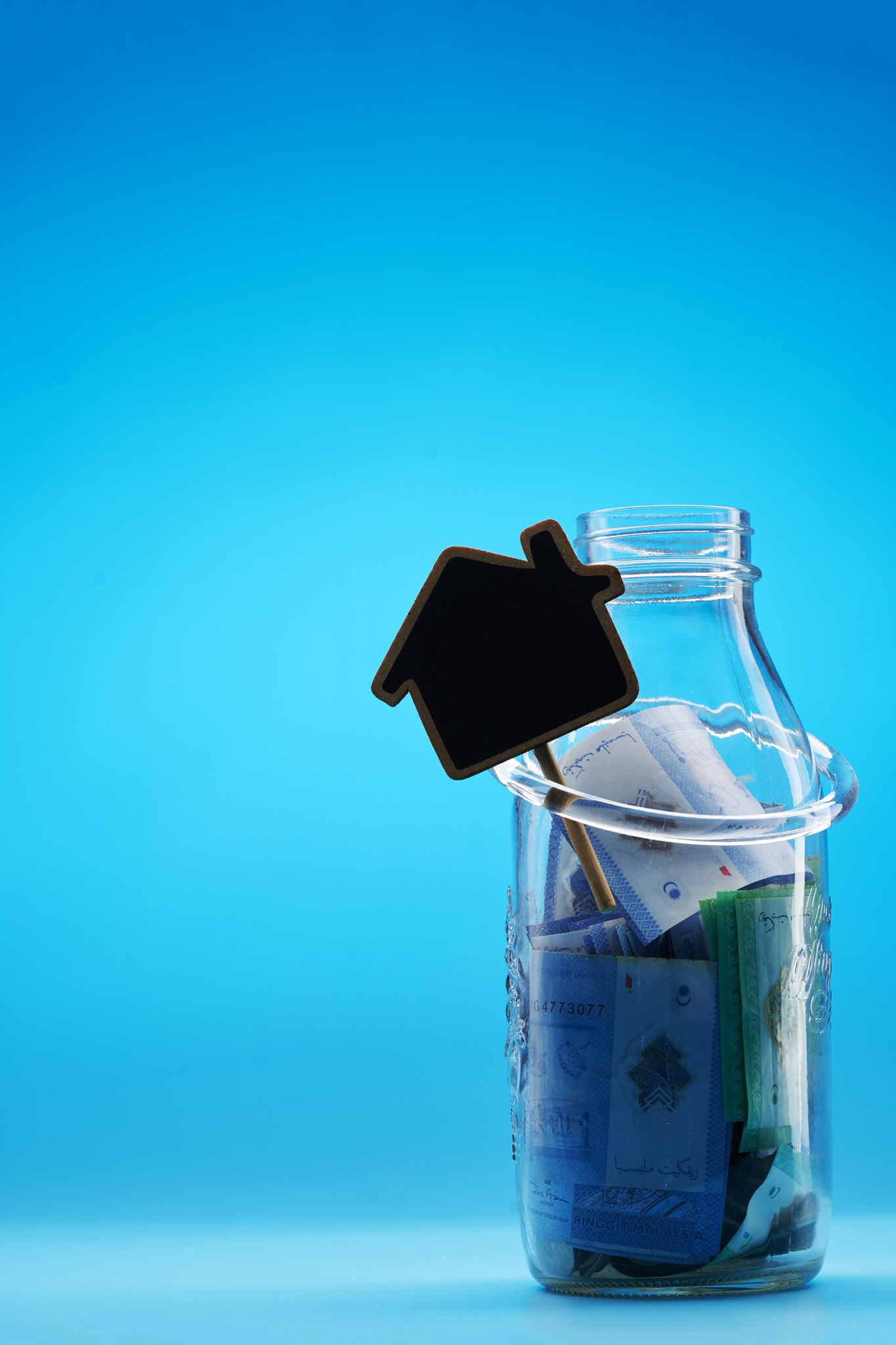 saving jar with with house shaped chalkboard