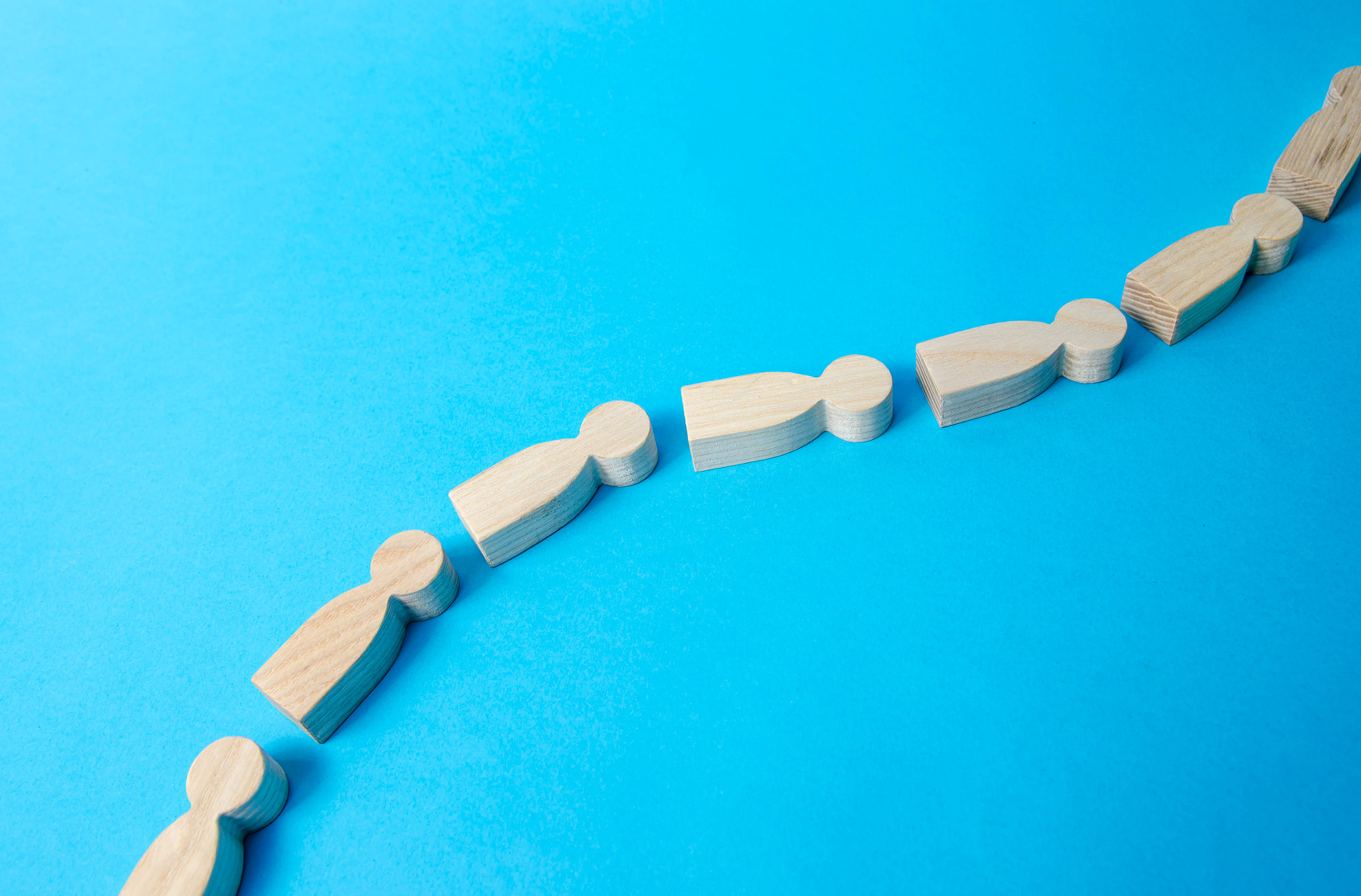 A sequential chain of people. Follow the leader. In a single stream. Spread of information and rumor