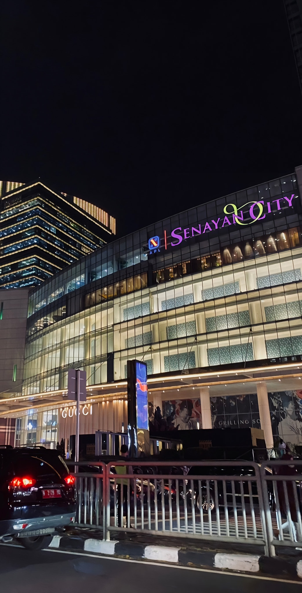 Illuminated skyline with urban architecture and street