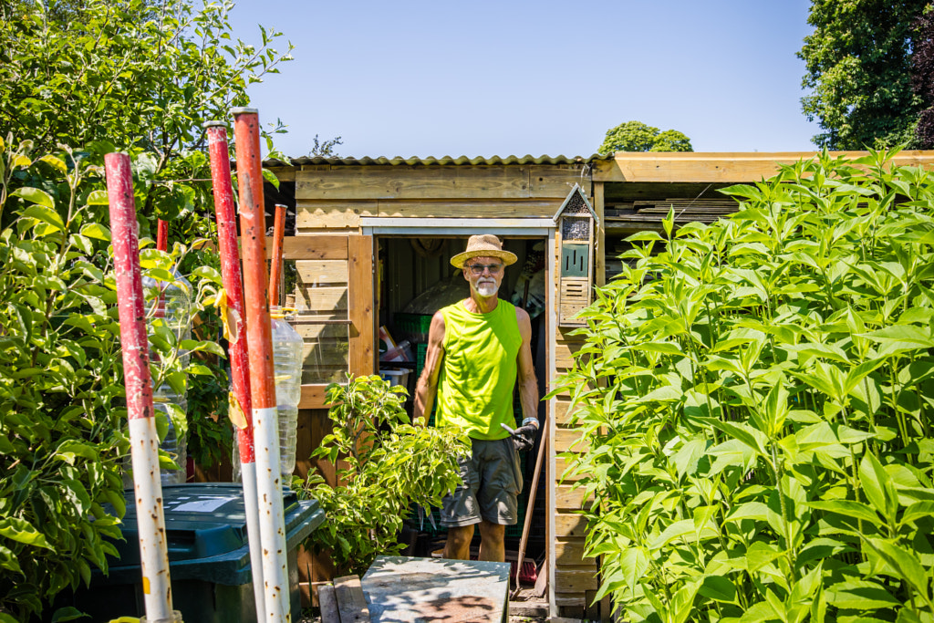 A man working in his allotment vegetable garden  by Peter van Haastrecht on 500px.com