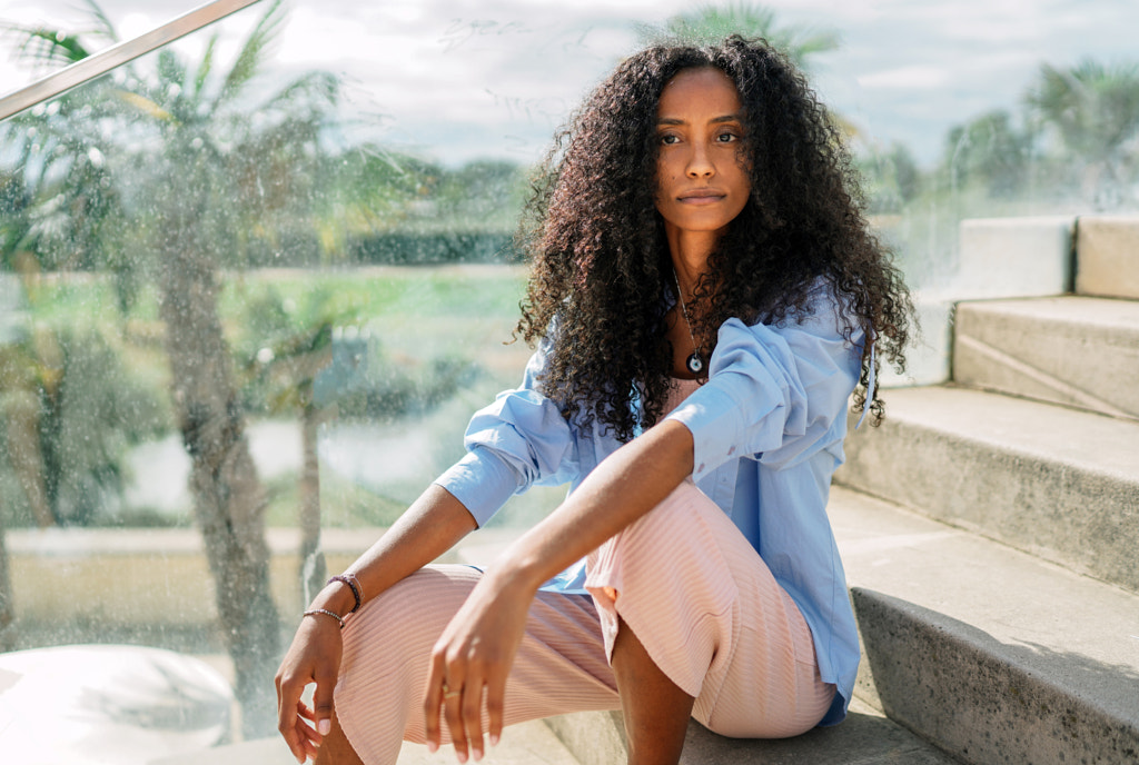 Portrait of young woman sitting on steps by Olha Dobosh on 500px.com