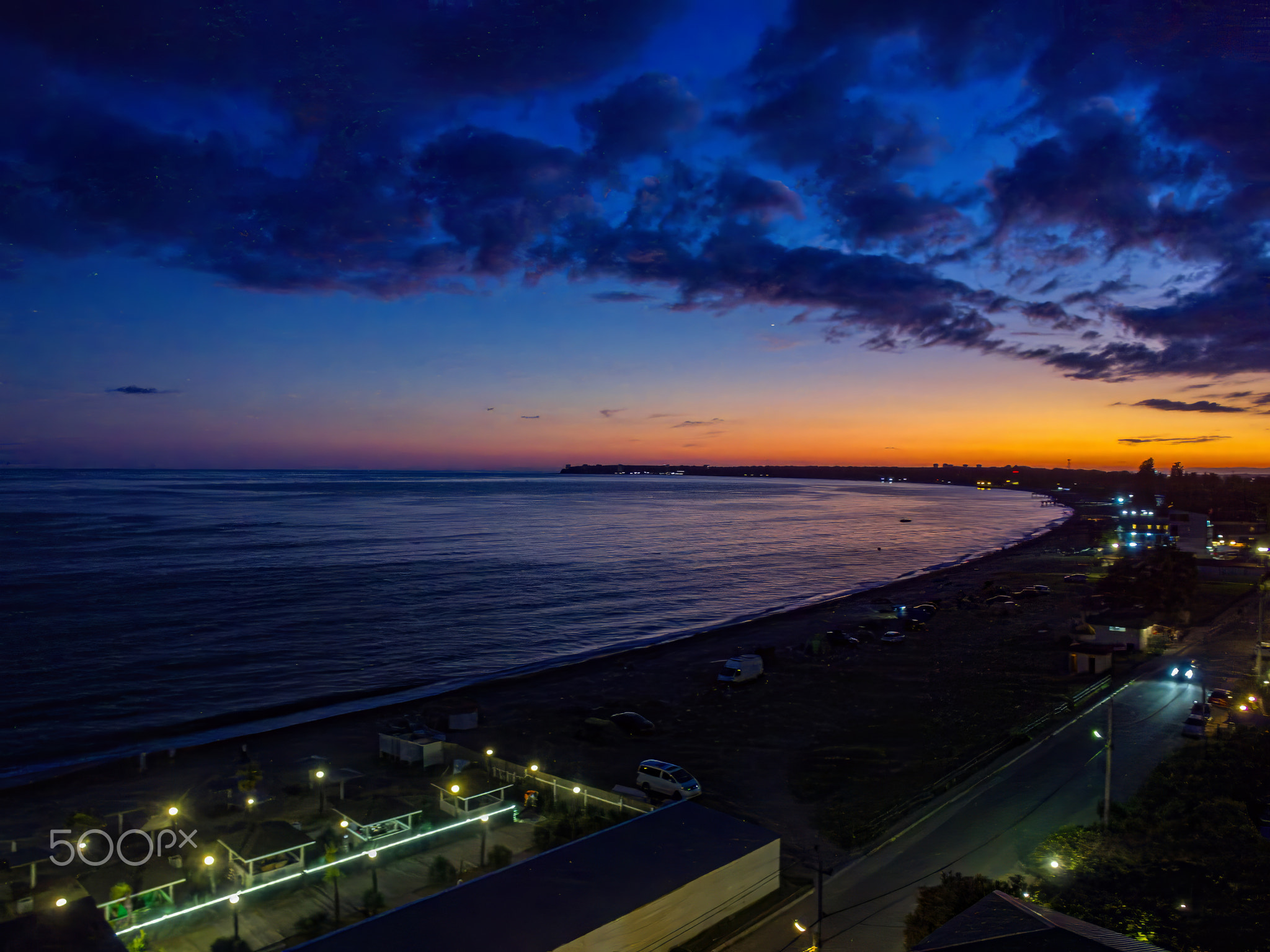 Bird's-eye view of the beach at night embankment at sunset