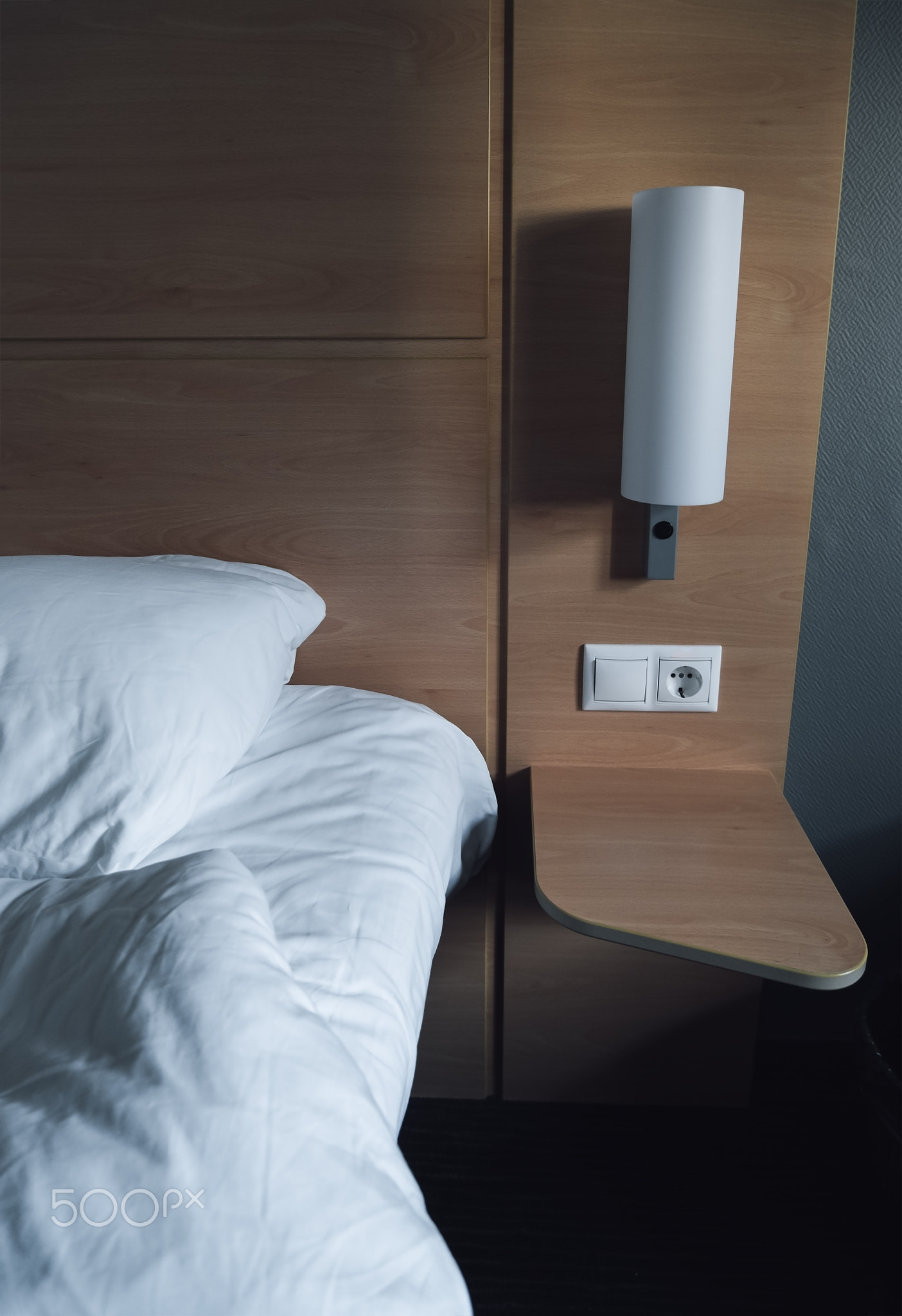 Bedroom Double bed have left bolster and lamp. 