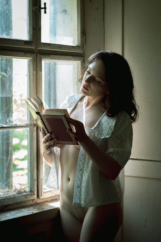 with a book at the window by Ruth Franke on 500px.com