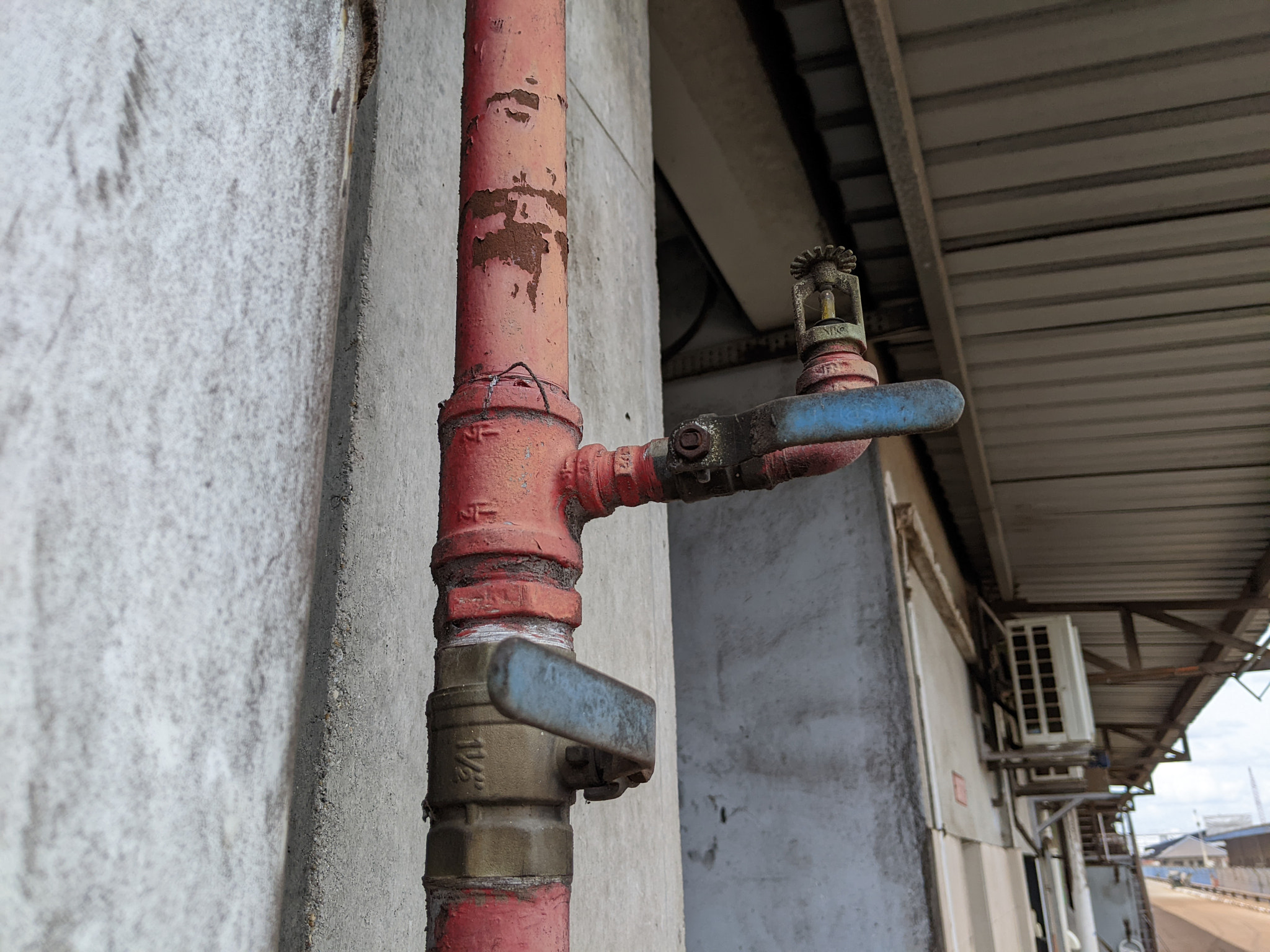 Low angle view of pipe on wall