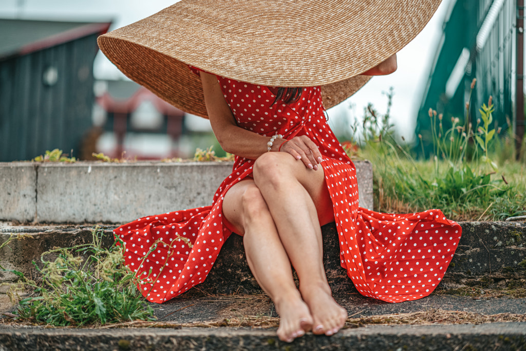 Red dress under the hat by Pranas Karpavicius on 500px.com