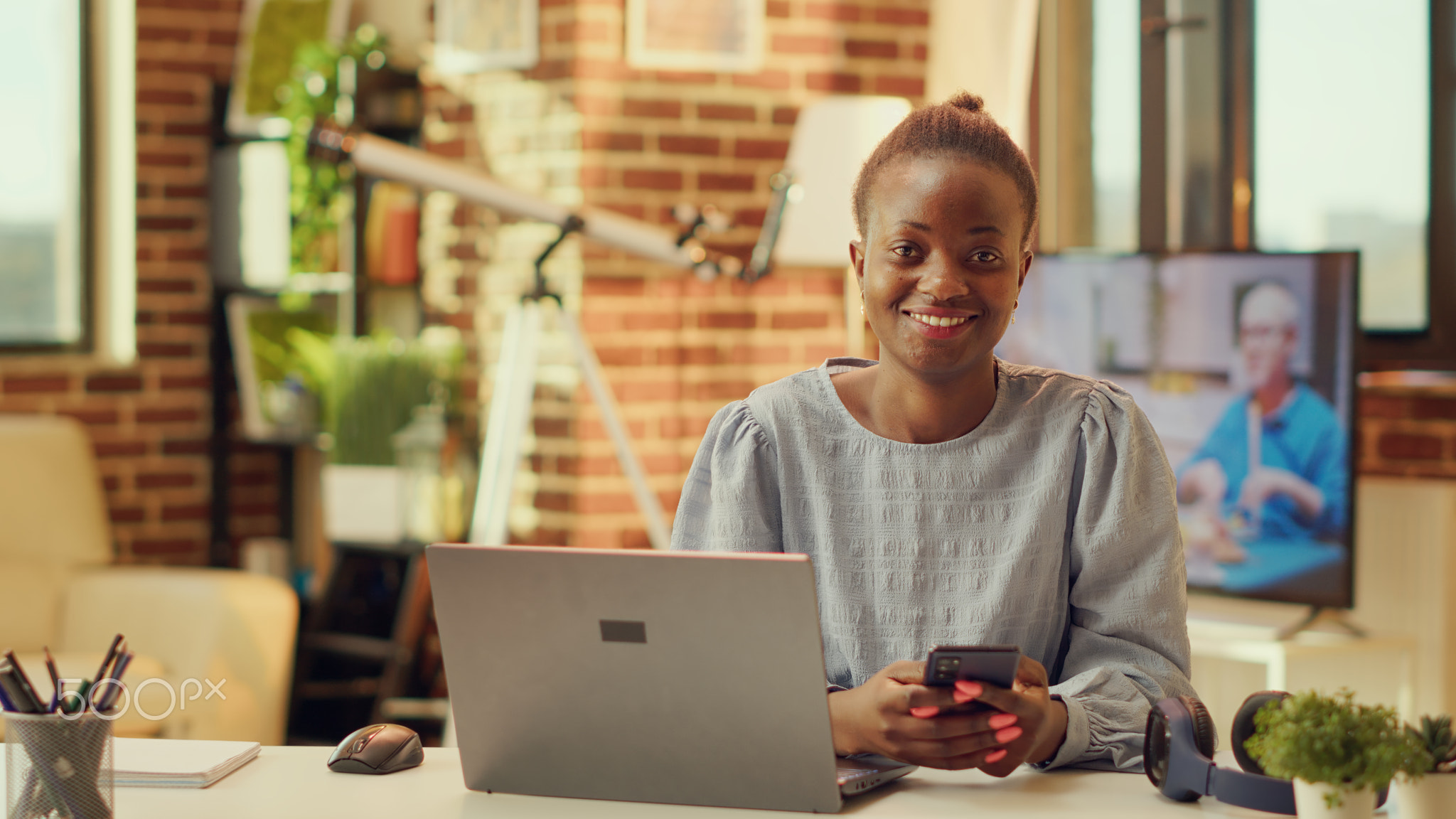 Portrait of smiling person on smartphone