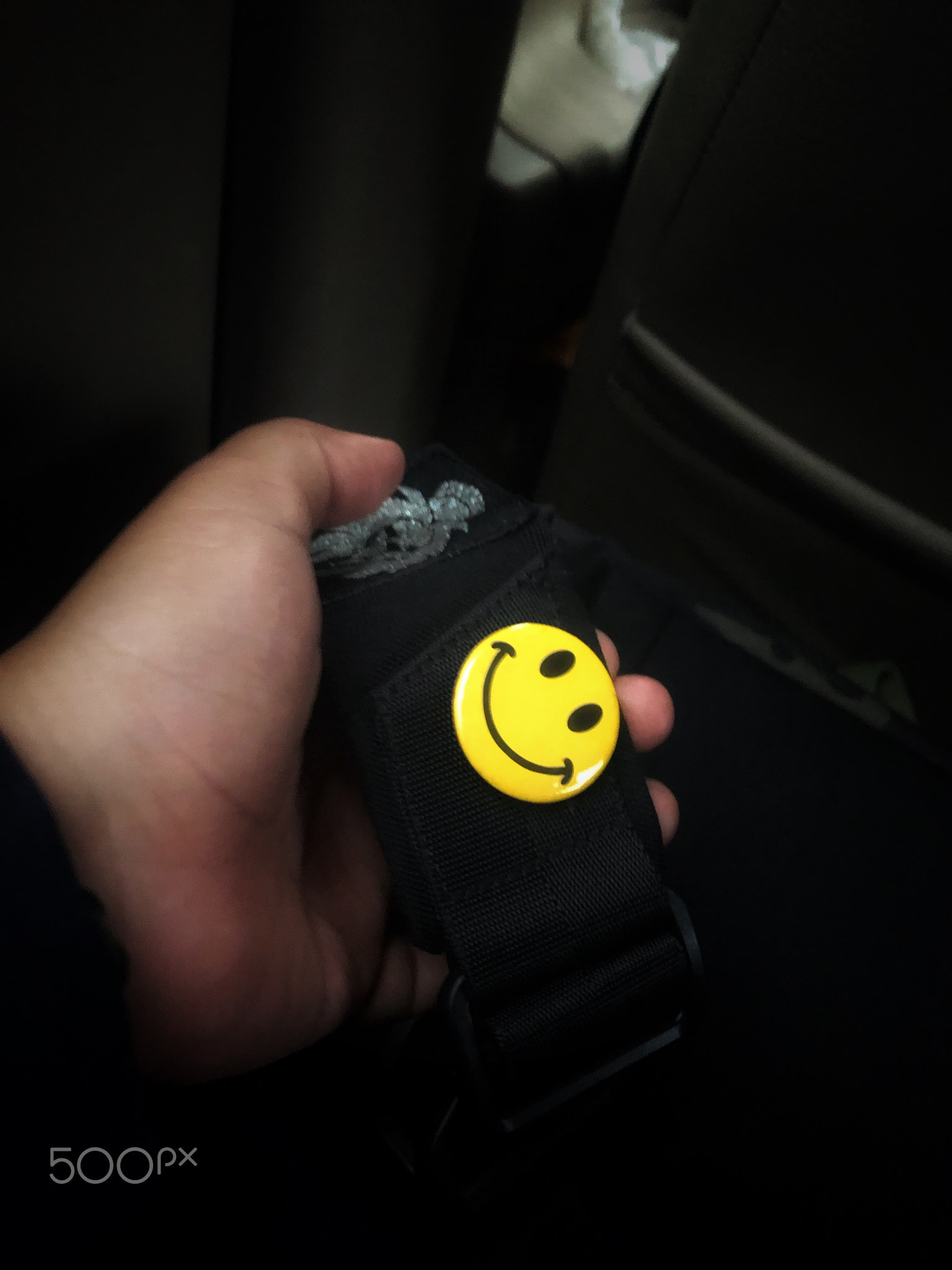 The smiling symbol pin