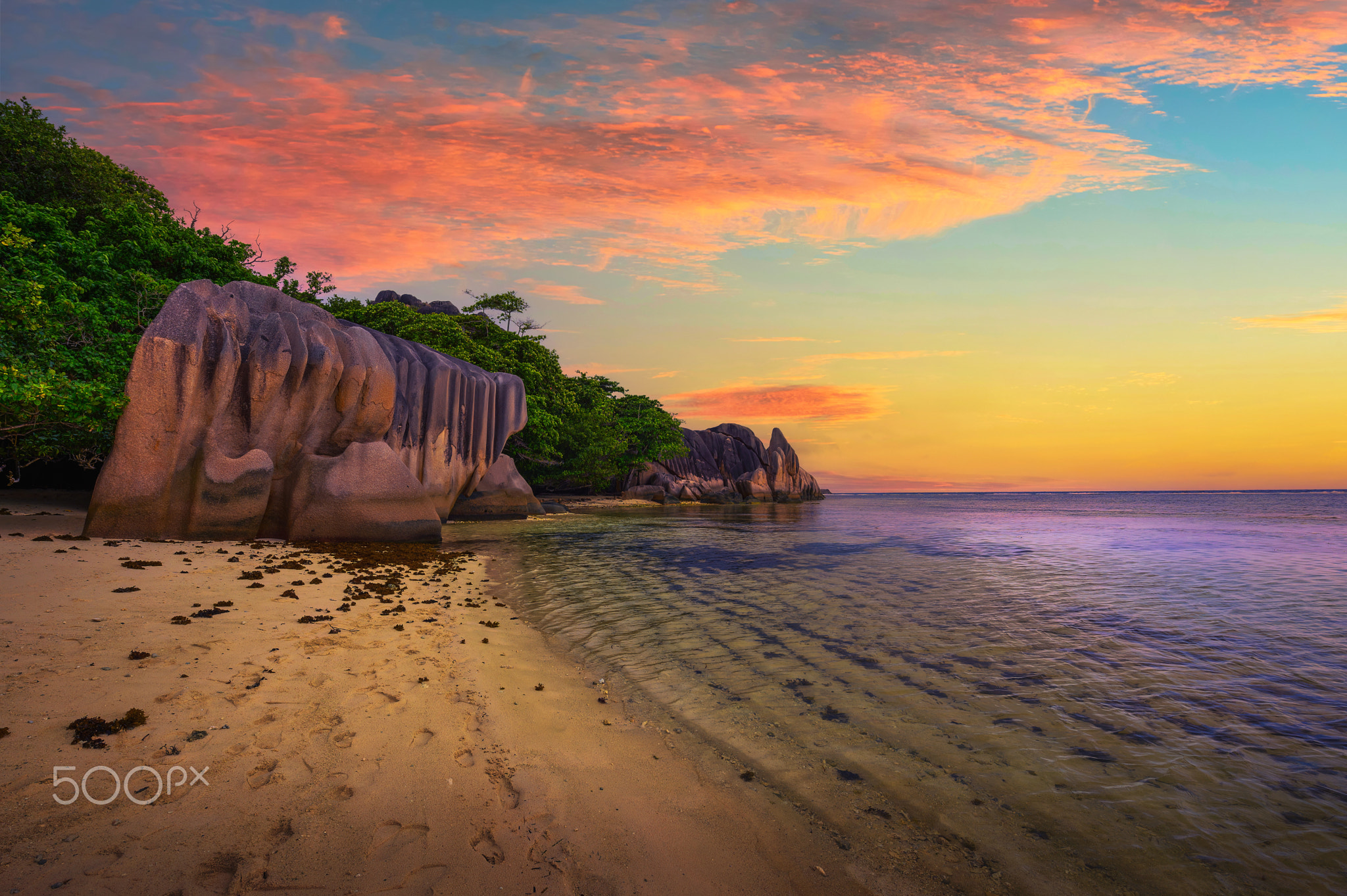 Colorful sunset over Anse Source D'argent beach at La Digue Island, Seychelles
