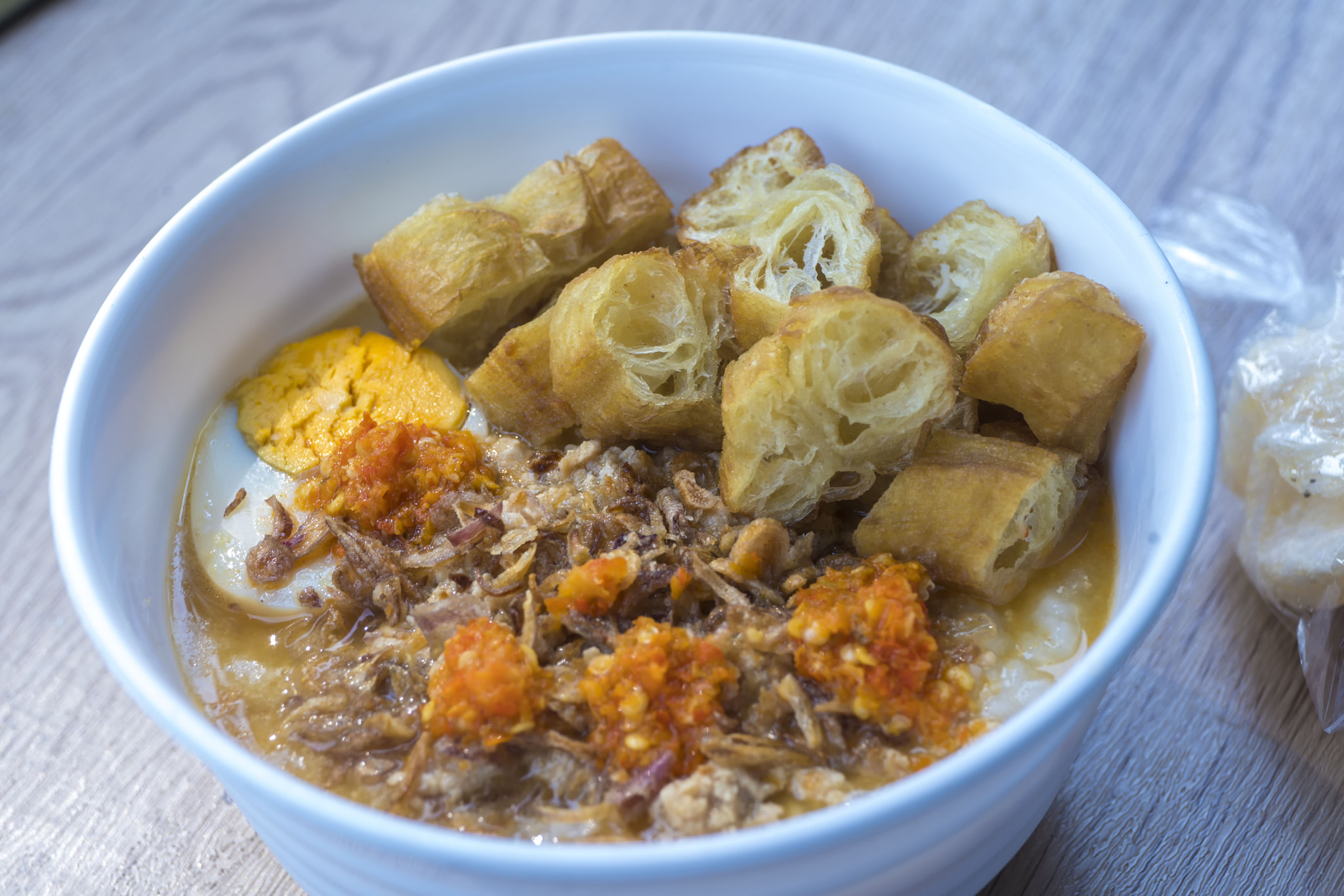 Bubur ayam or chicken porridge is a popular Indonesian breakfast porridge.