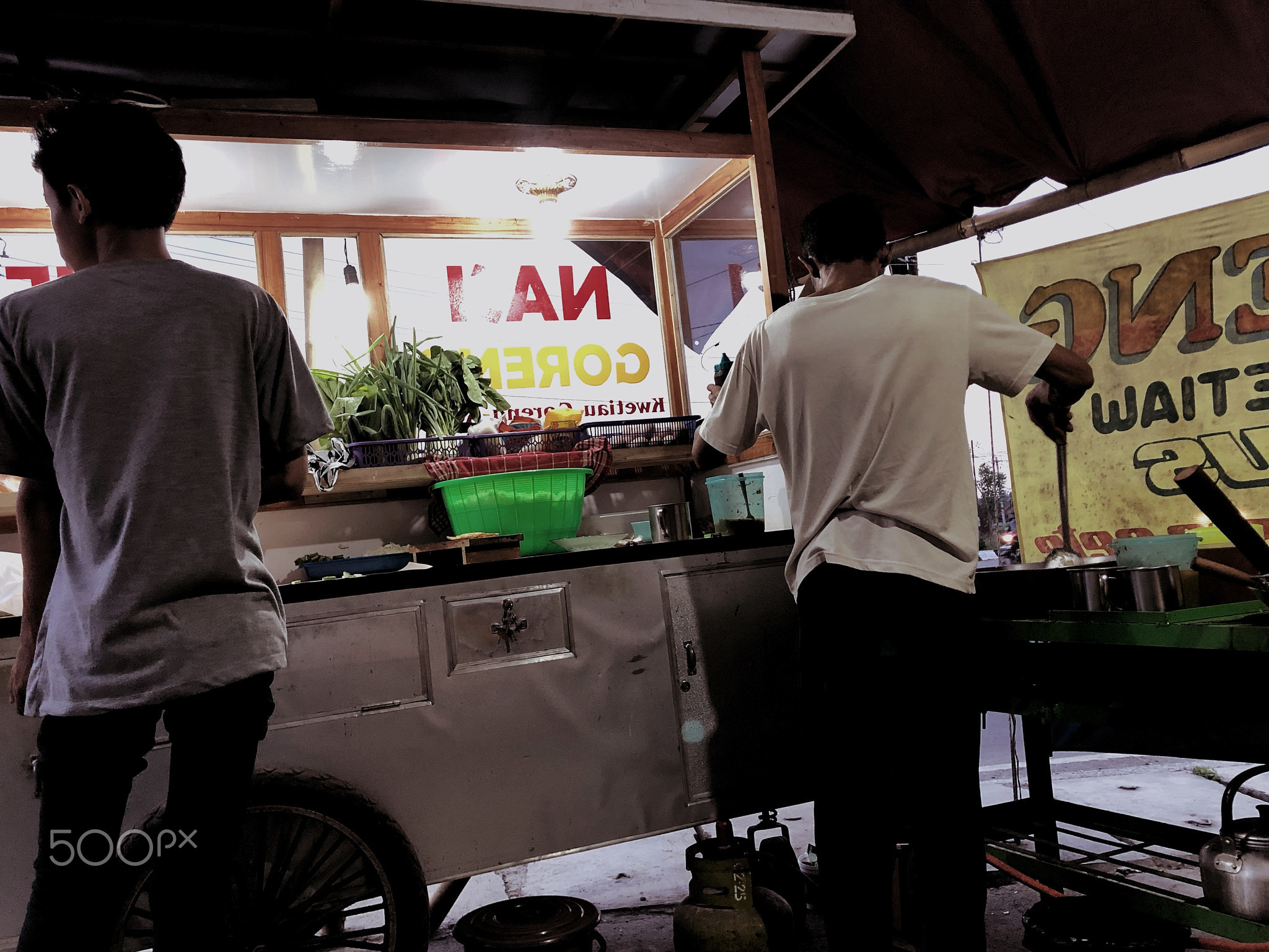 Father and son selling fried rice